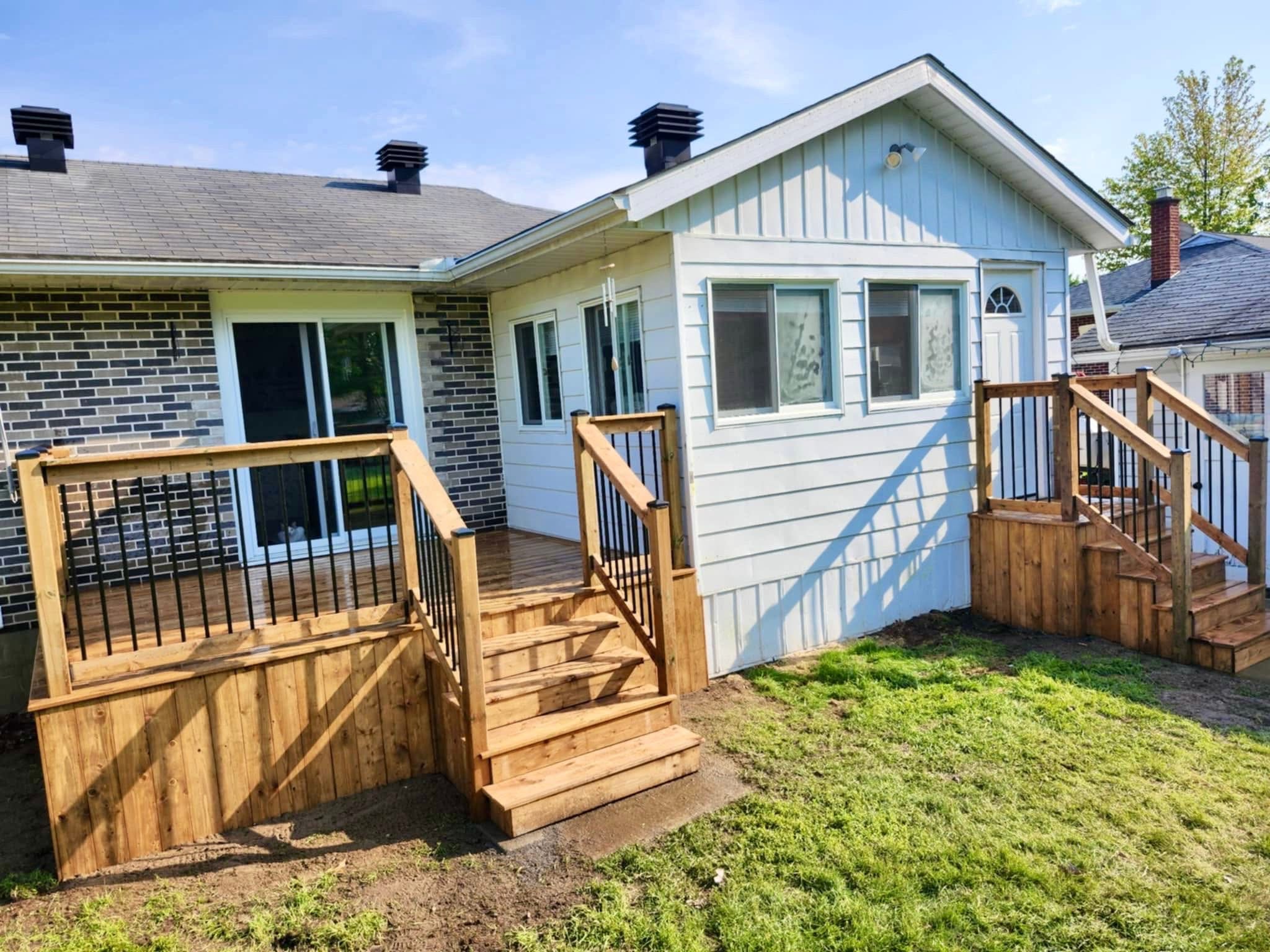 Backyard deck with dual staircases