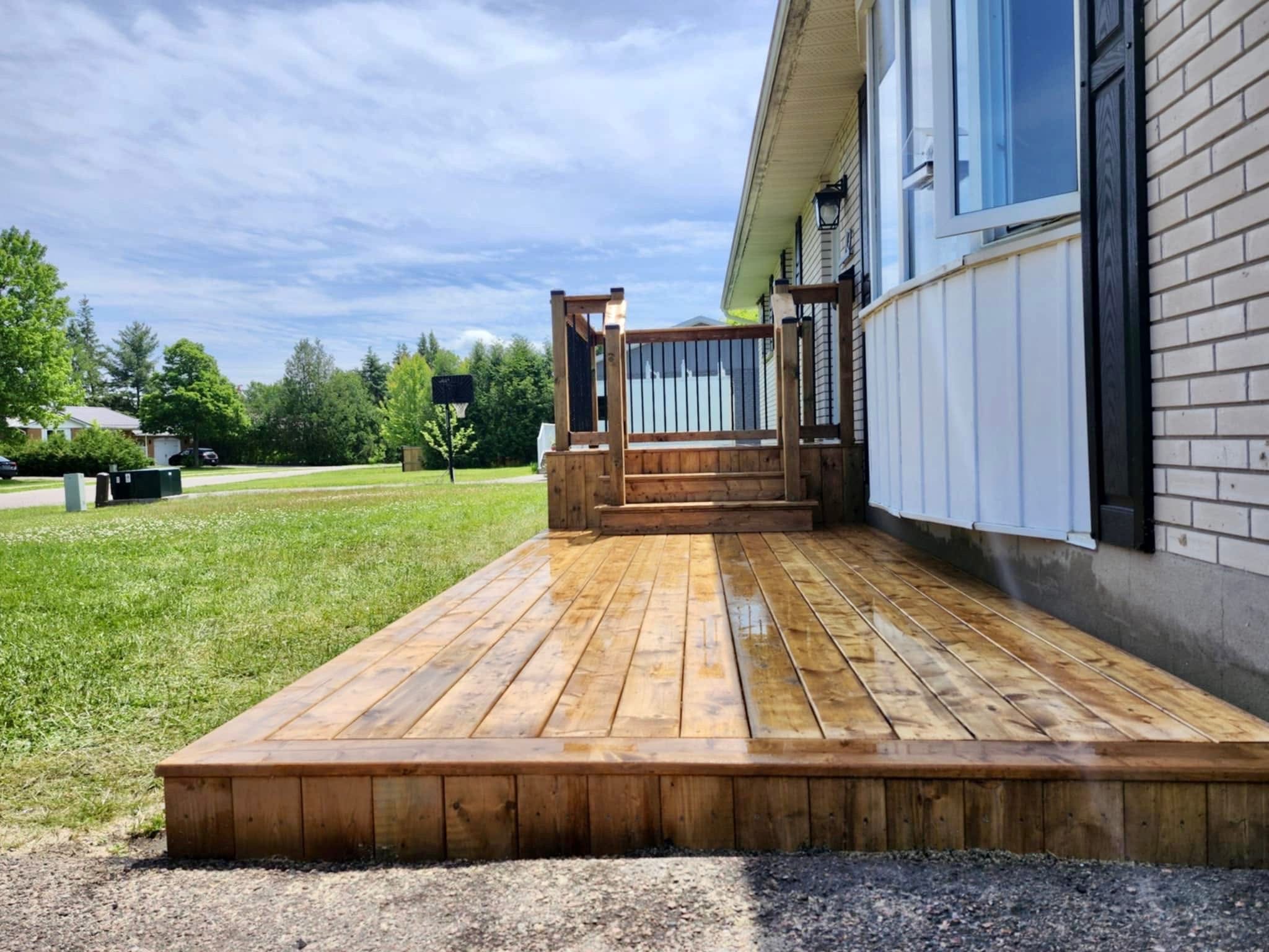 Cedar deck with railing side view