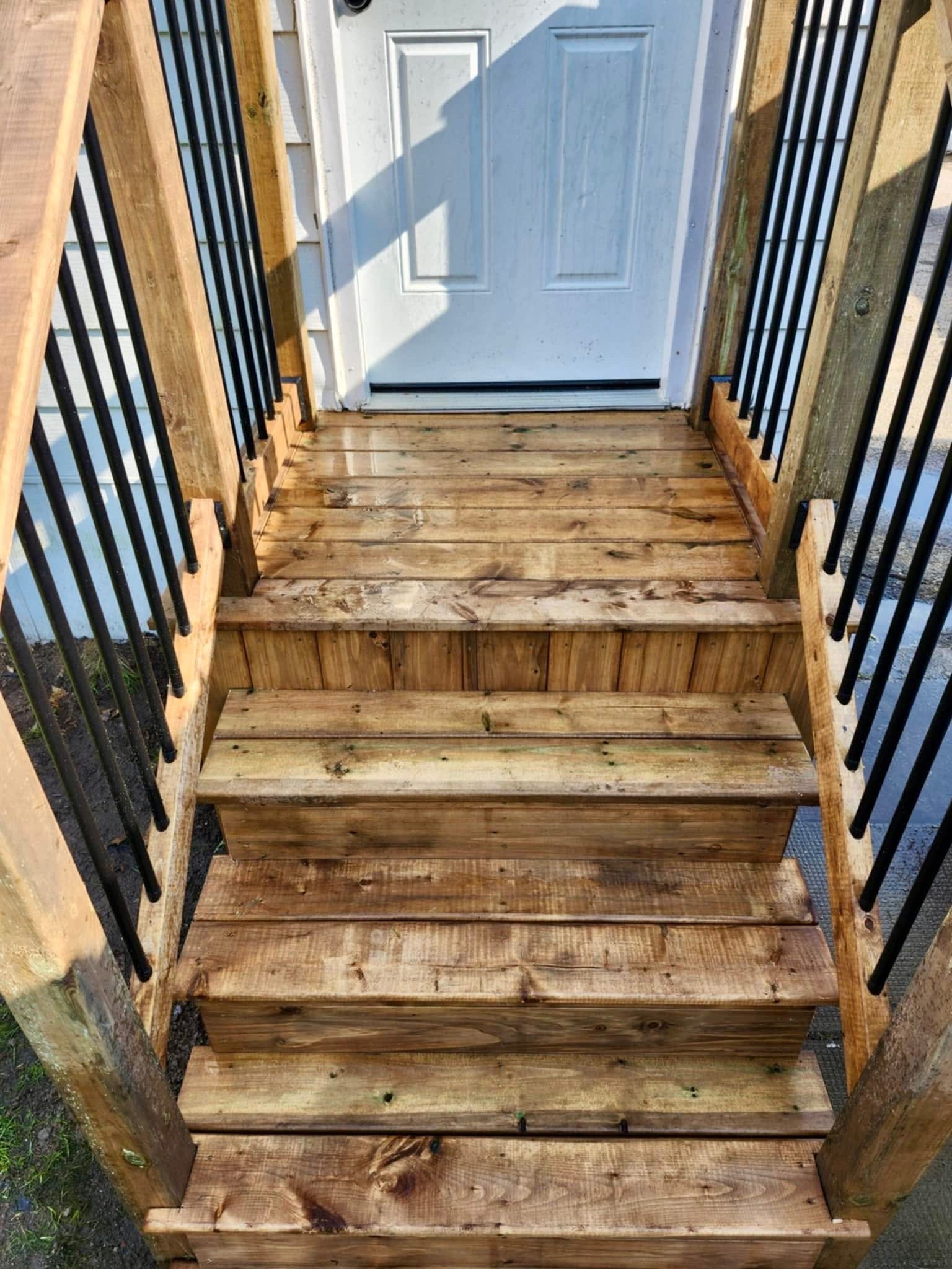 Deck stairs with black balusters close-up
