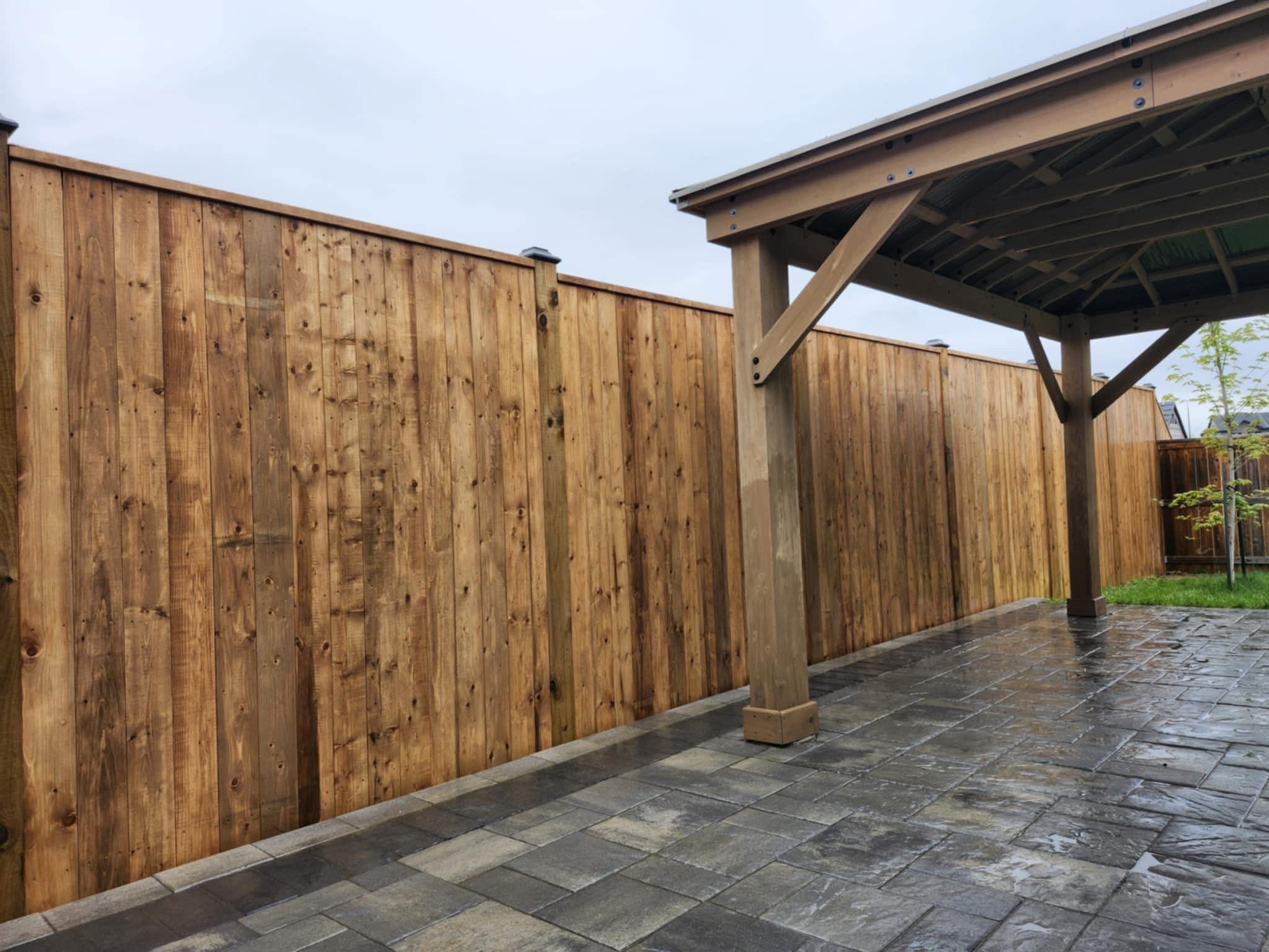 Cedar fence with carport structure