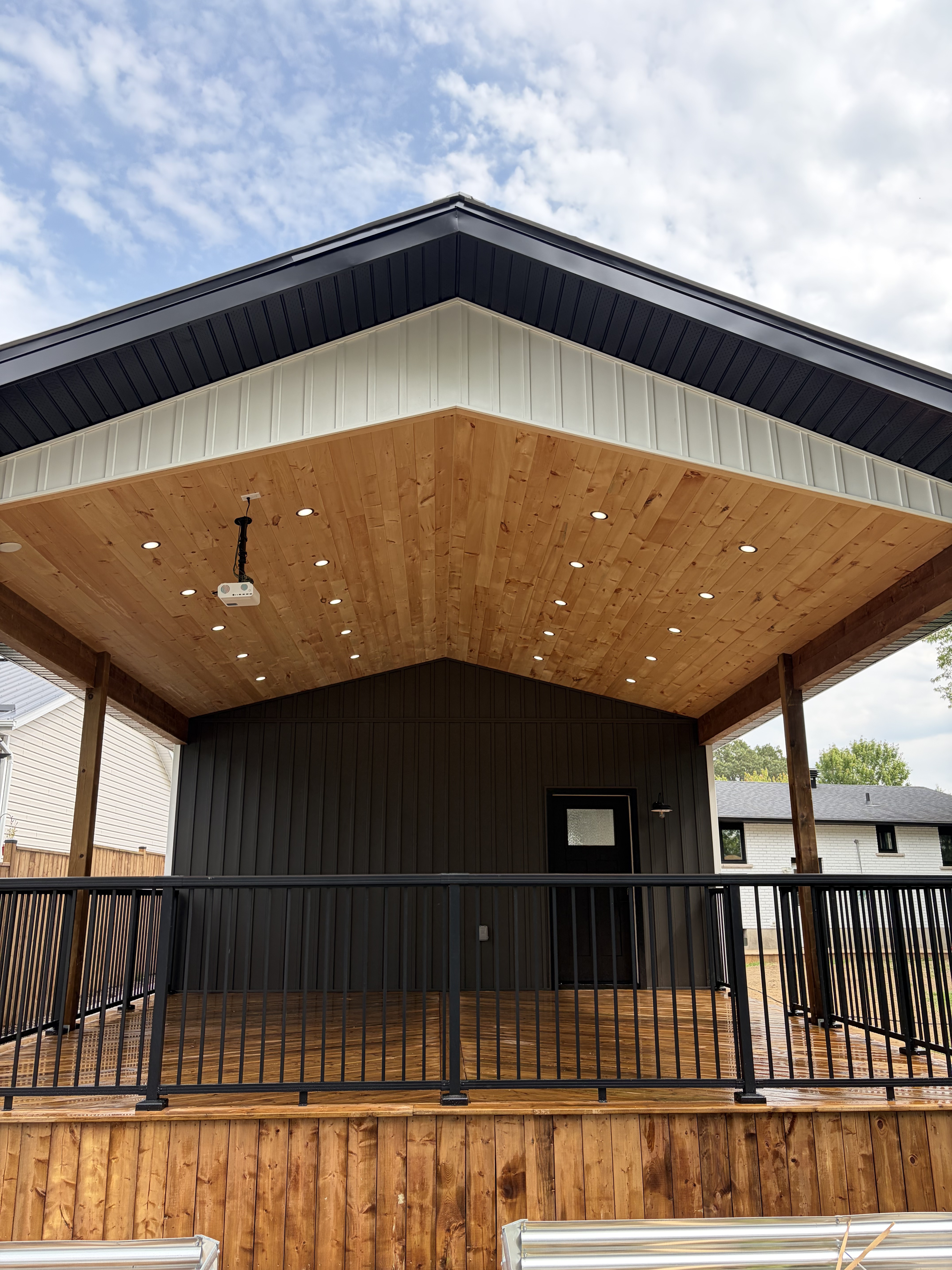 Custom garage gable view with cedar soffit and pot lights