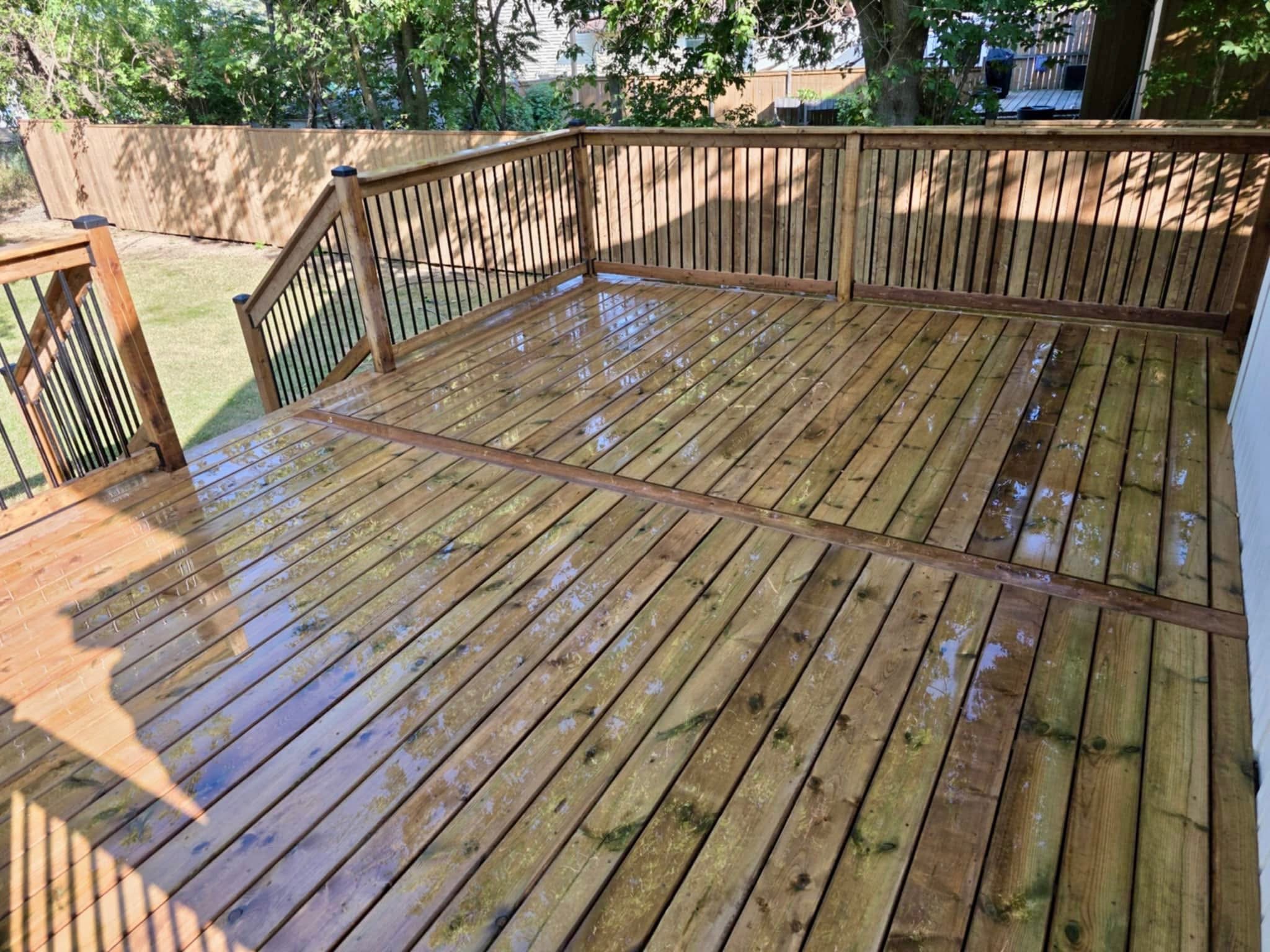 Spacious backyard deck with privacy fence