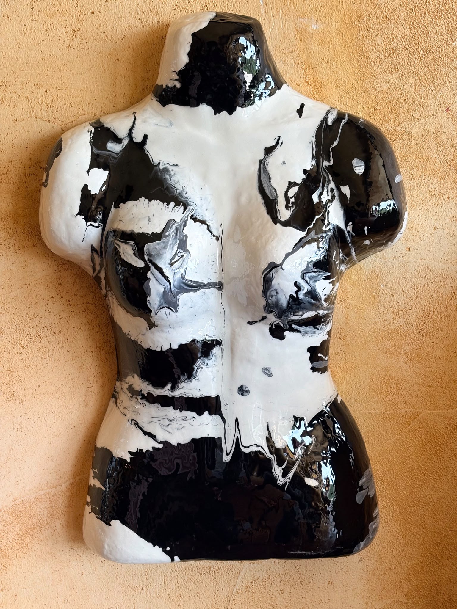 Cruella's Vision — striking black and white poured-paint bust