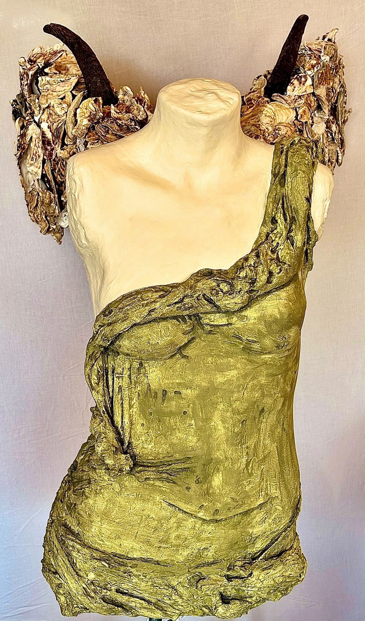 The Swoosh of Nike — golden draped bust with natural horn and organic shoulder pieces