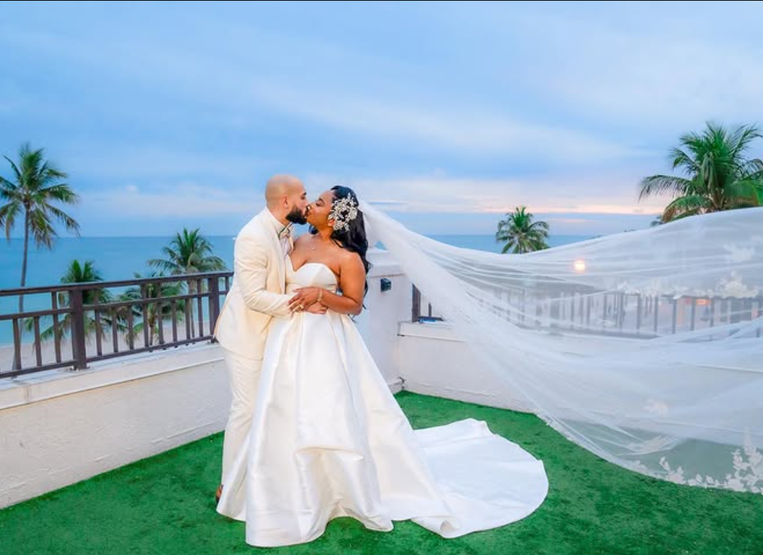 Romantic couple portrait with flowing veil at sunset — JM Weddings Events