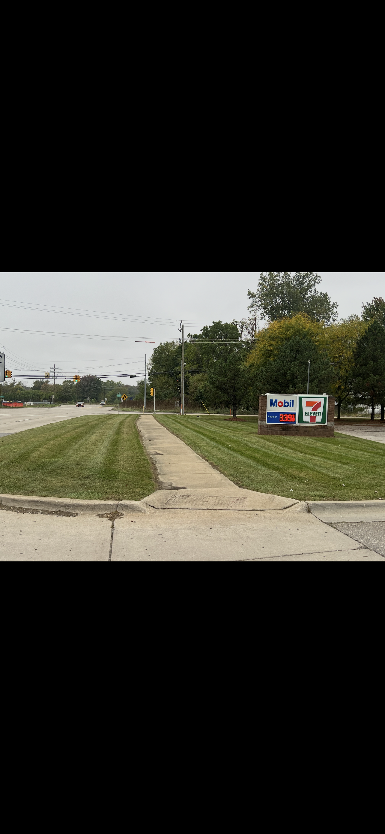 Commercial property maintenance with clean mowing stripes