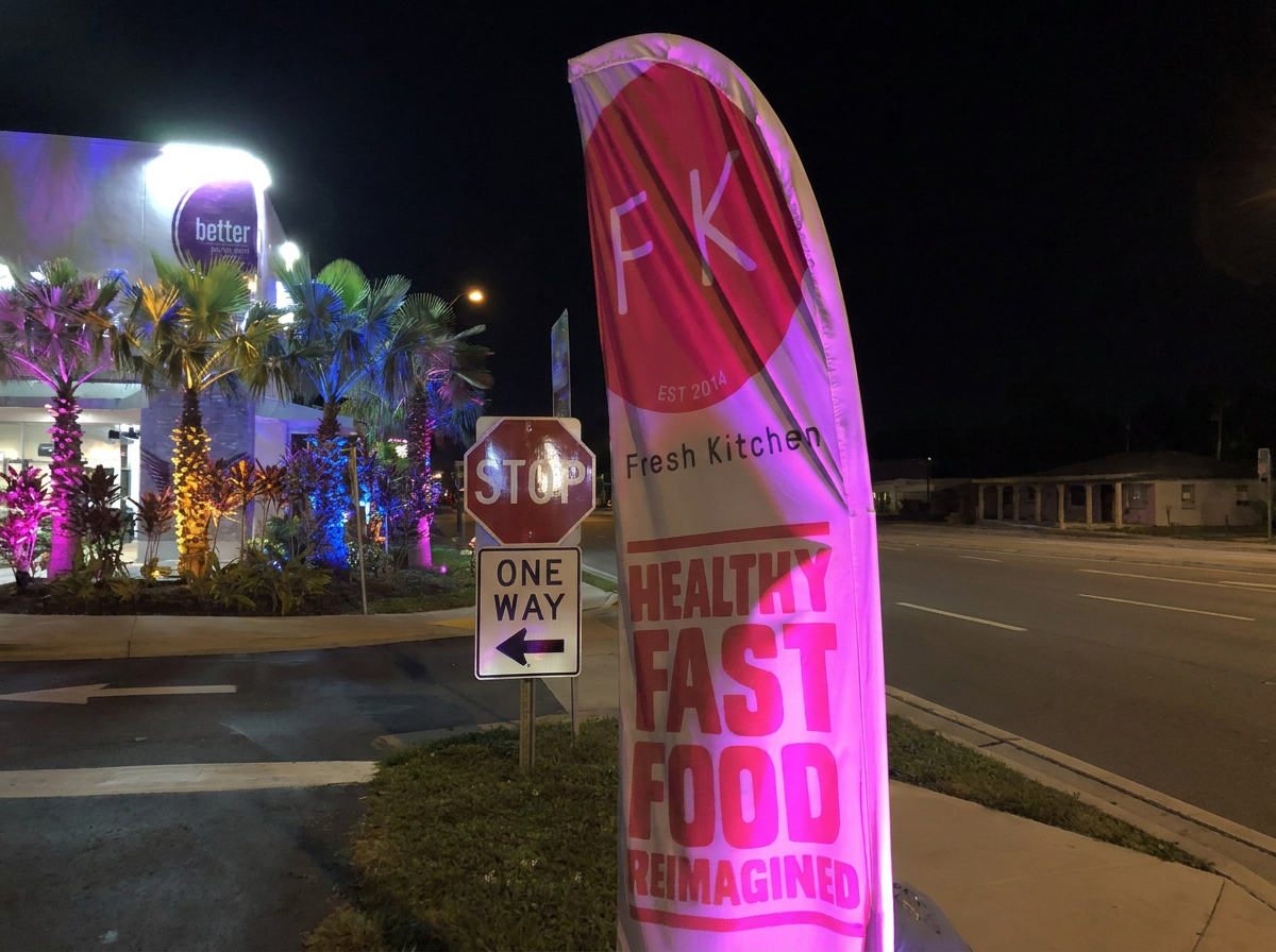 Fresh Kitchen Tampa restaurant exterior green RGBW LED lighting and magenta sign at night