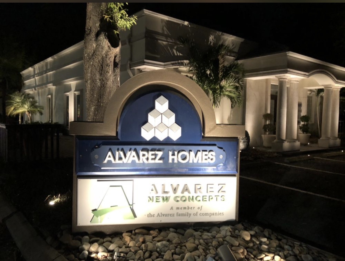 Alvarez Homes headquarters in Tampa lit by LED Artistry — architectural uplighting on luxury home builder showroom