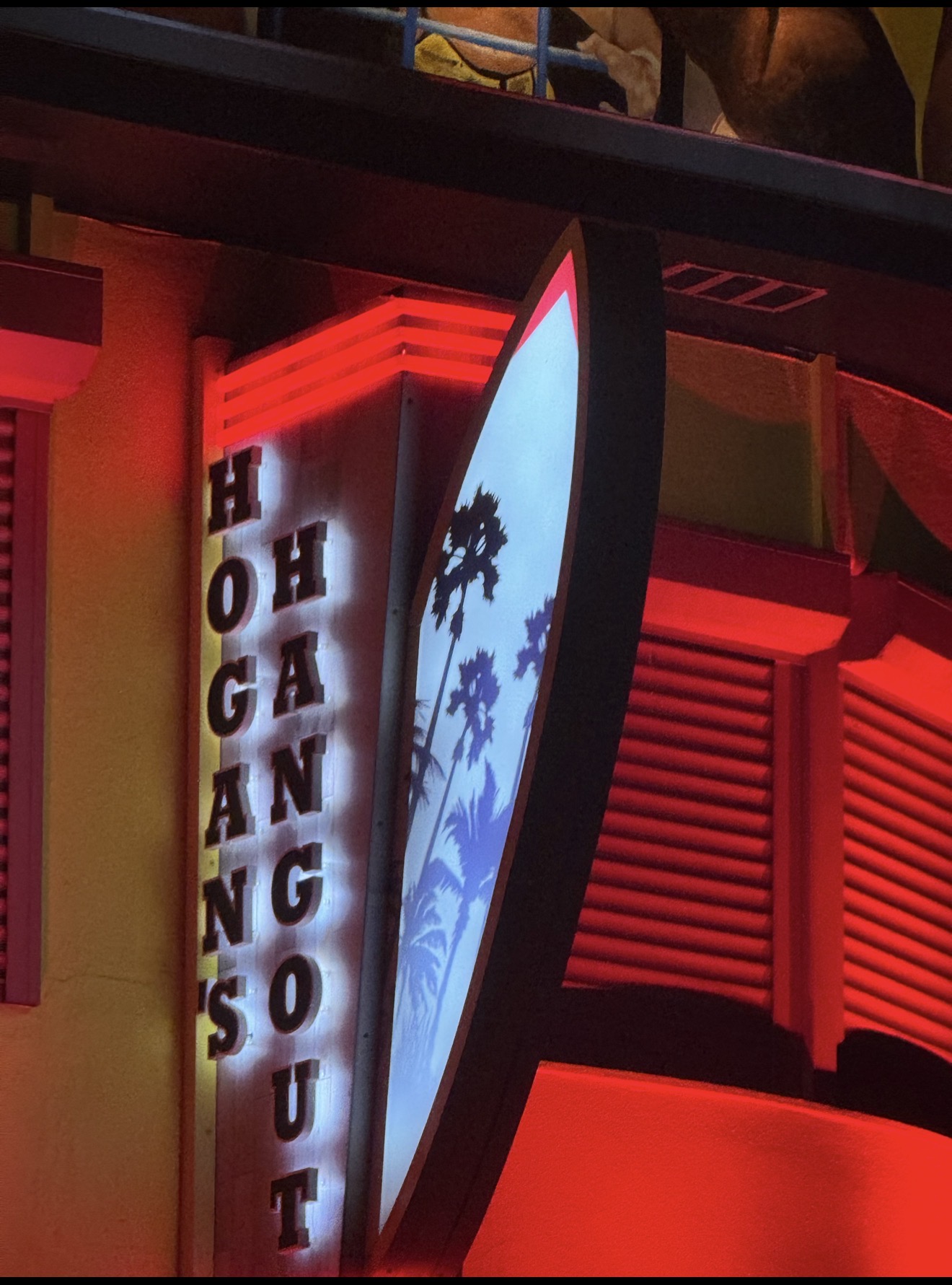 Close-up of LED uplights installed in concrete ledge at Hogan's Hangout Clearwater Beach — red and white RGBW fixtures by LED Artistry