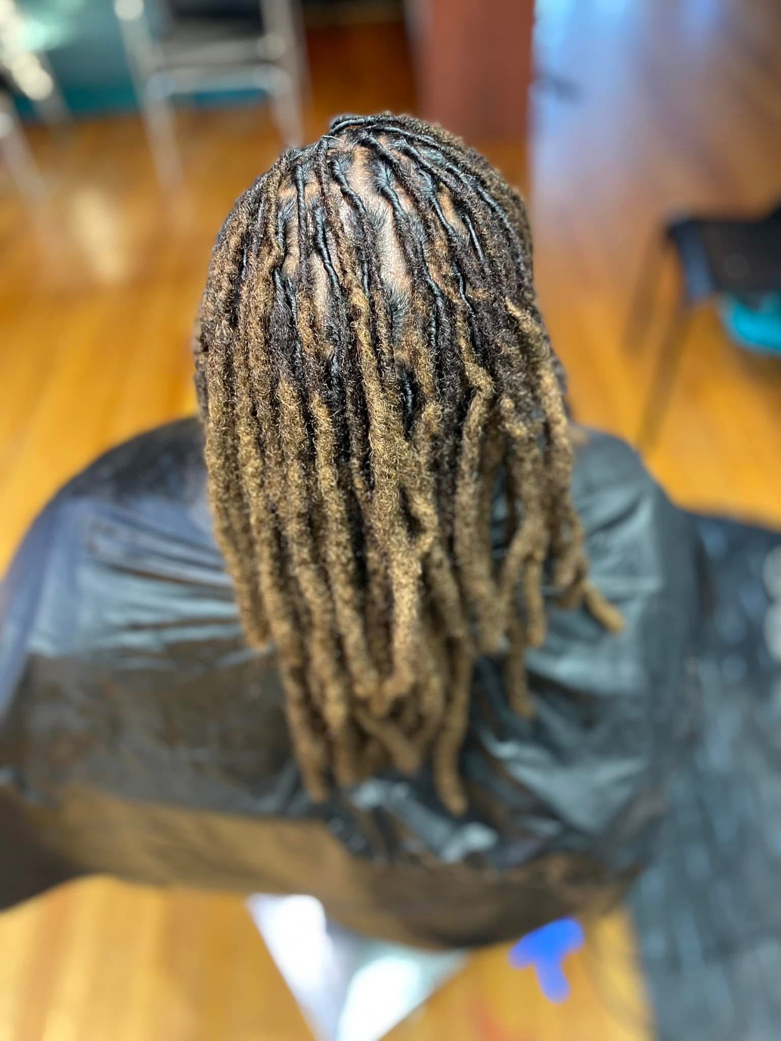 Professional loc retwist and maintenance showing clean parts and healthy locs at Pure Masters Lounge Rochester NY Professional loc retwist and maintenance showing clean parts and healthy locs at Pure Masters Lounge Rochester NY