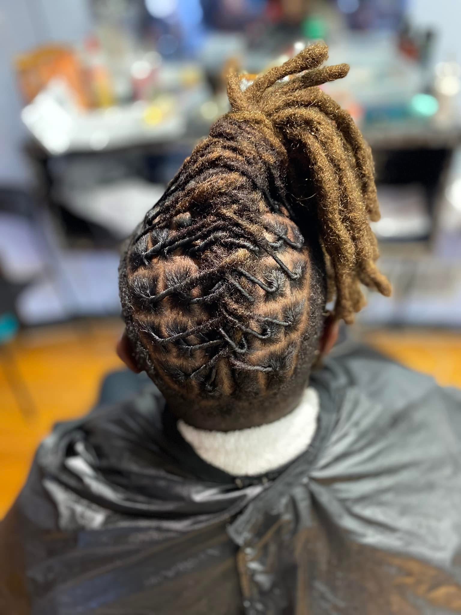Back view of intricate loc retwist pattern with gathered top by Loc'd In Wit Lexx at Pure Masters Lounge Rochester NY Back view of intricate loc retwist pattern with gathered top by Loc'd In Wit Lexx at Pure Masters Lounge Rochester NY