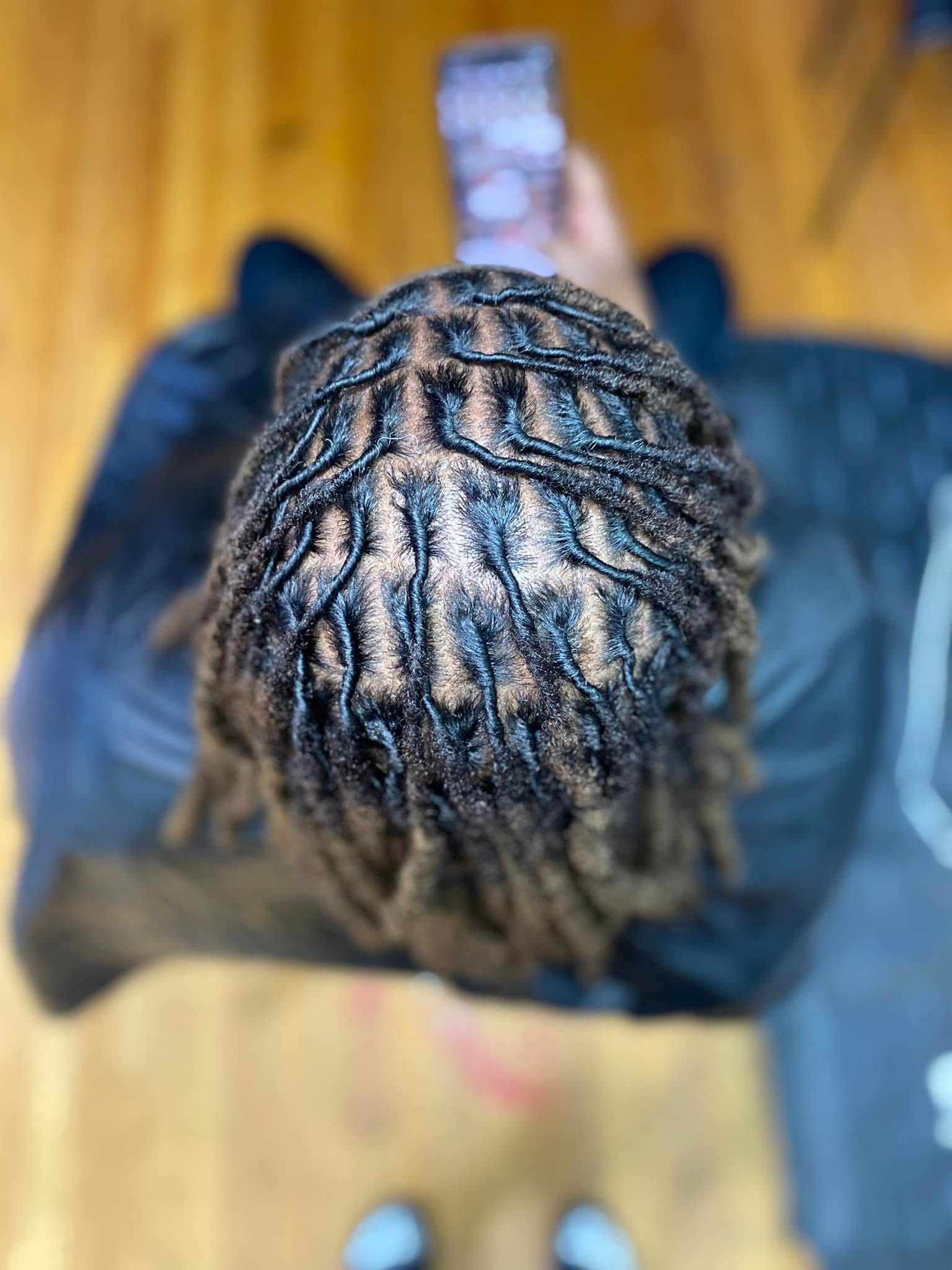 Top view of fresh loc retwist with precise parting and neat sections by Loc'd In Wit Lexx at Pure Masters Lounge Rochester Top view of fresh loc retwist with precise parting and neat sections by Loc'd In Wit Lexx at Pure Masters Lounge Rochester