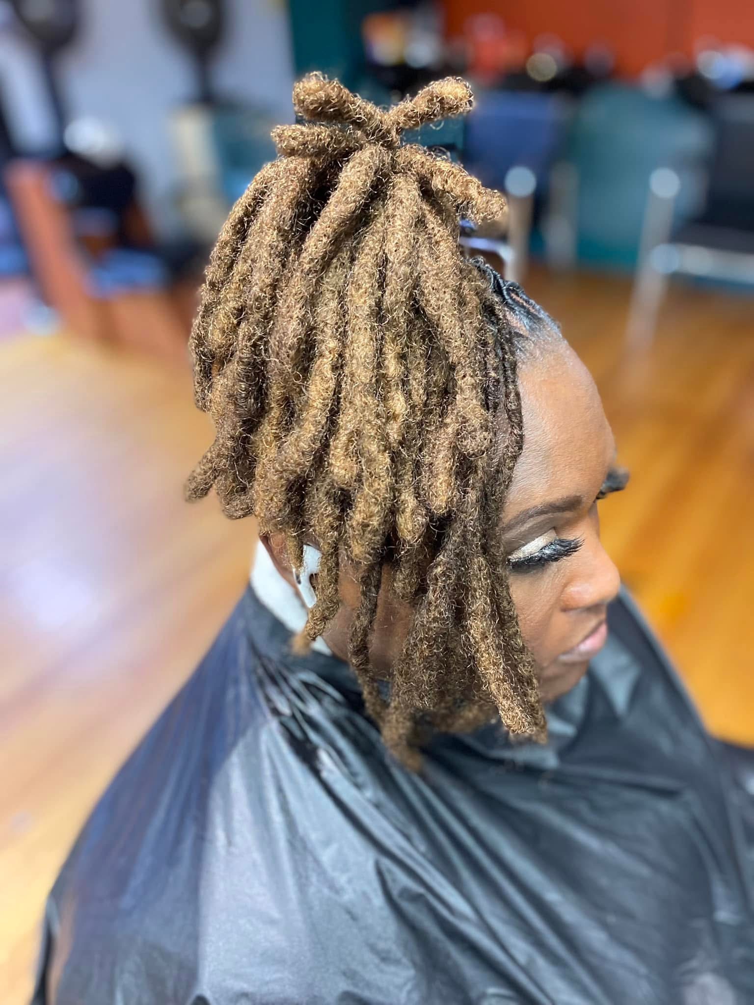 Side profile of styled locs with volume and texture at Pure Masters Lounge Rochester NY Side profile of styled locs with volume and texture at Pure Masters Lounge Rochester NY