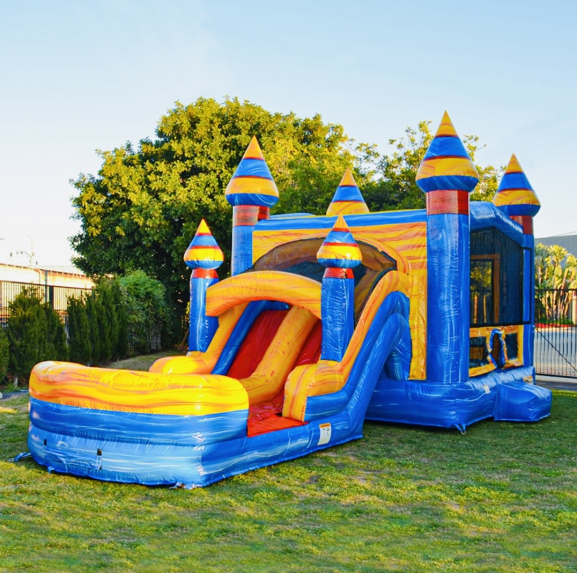 Jelly Bean Castle combo unit with slide and bounce house in backyard