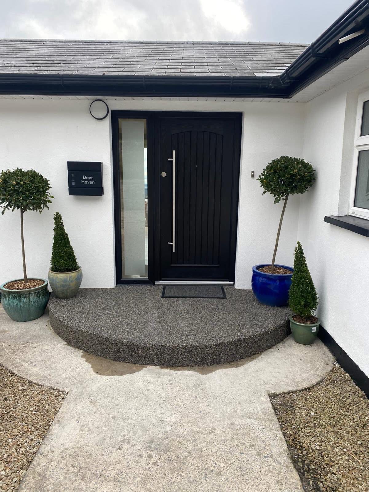 Resin bound step landing at a residential entrance in Dublin