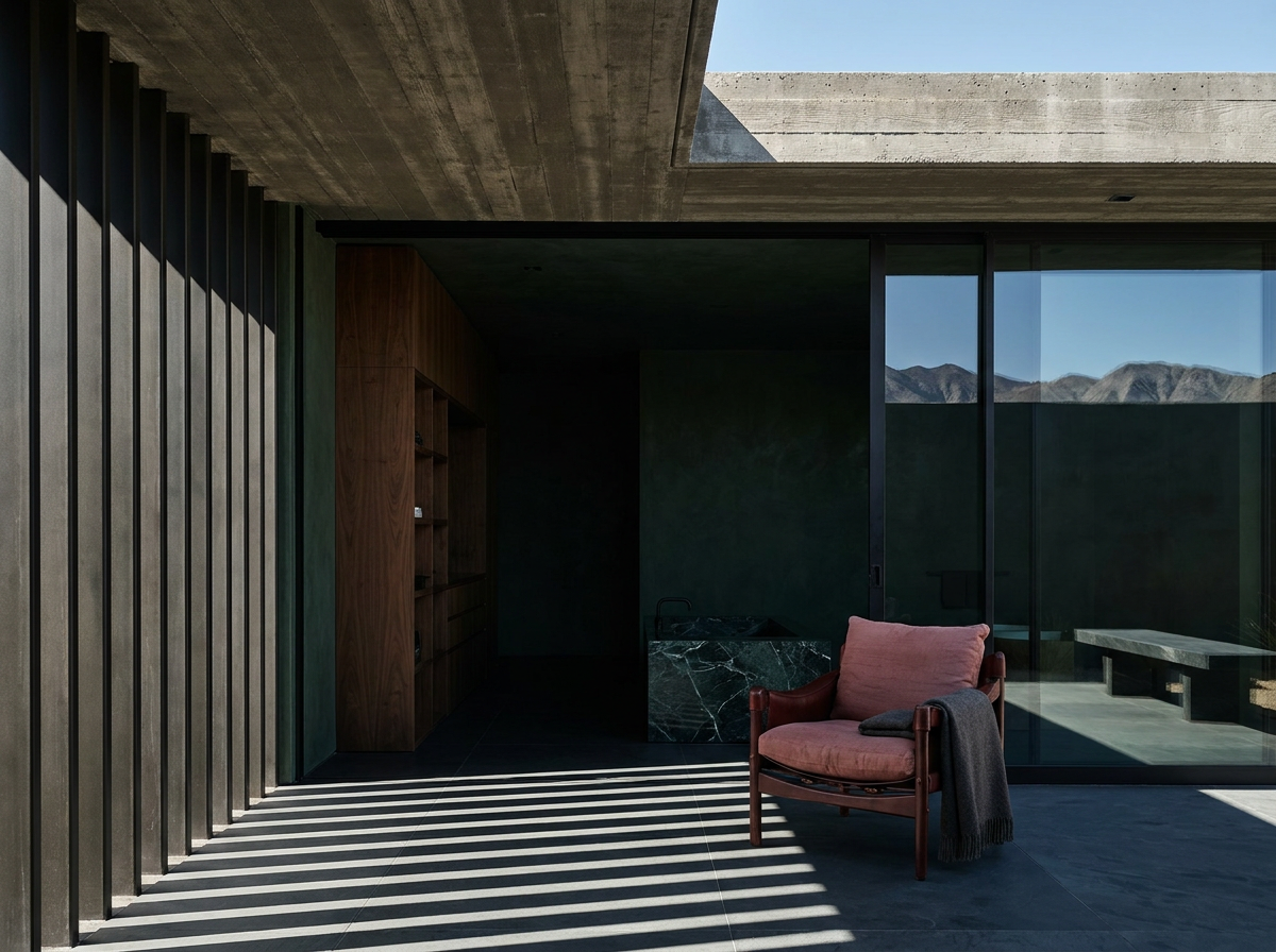 Interior design Palm Springs — a Coachella Valley desert residence in deep forest green with brise-soleil shadow across honed slate and a shaded stone terrace, by Beverly Hills Luxury Interiors