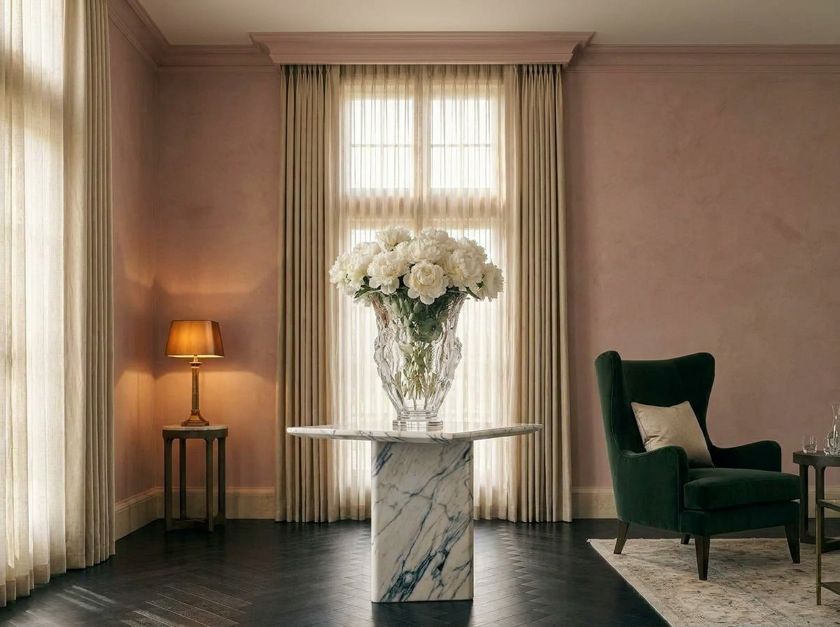 Ultra-luxury Quiet Luxury drawing room with dusty rose plaster walls, clear crystal vase with white peonies on ivory marble console, deep forest green velvet armchair — Quiet Luxury Considered Colour by Beverly Hills Luxury Interiors