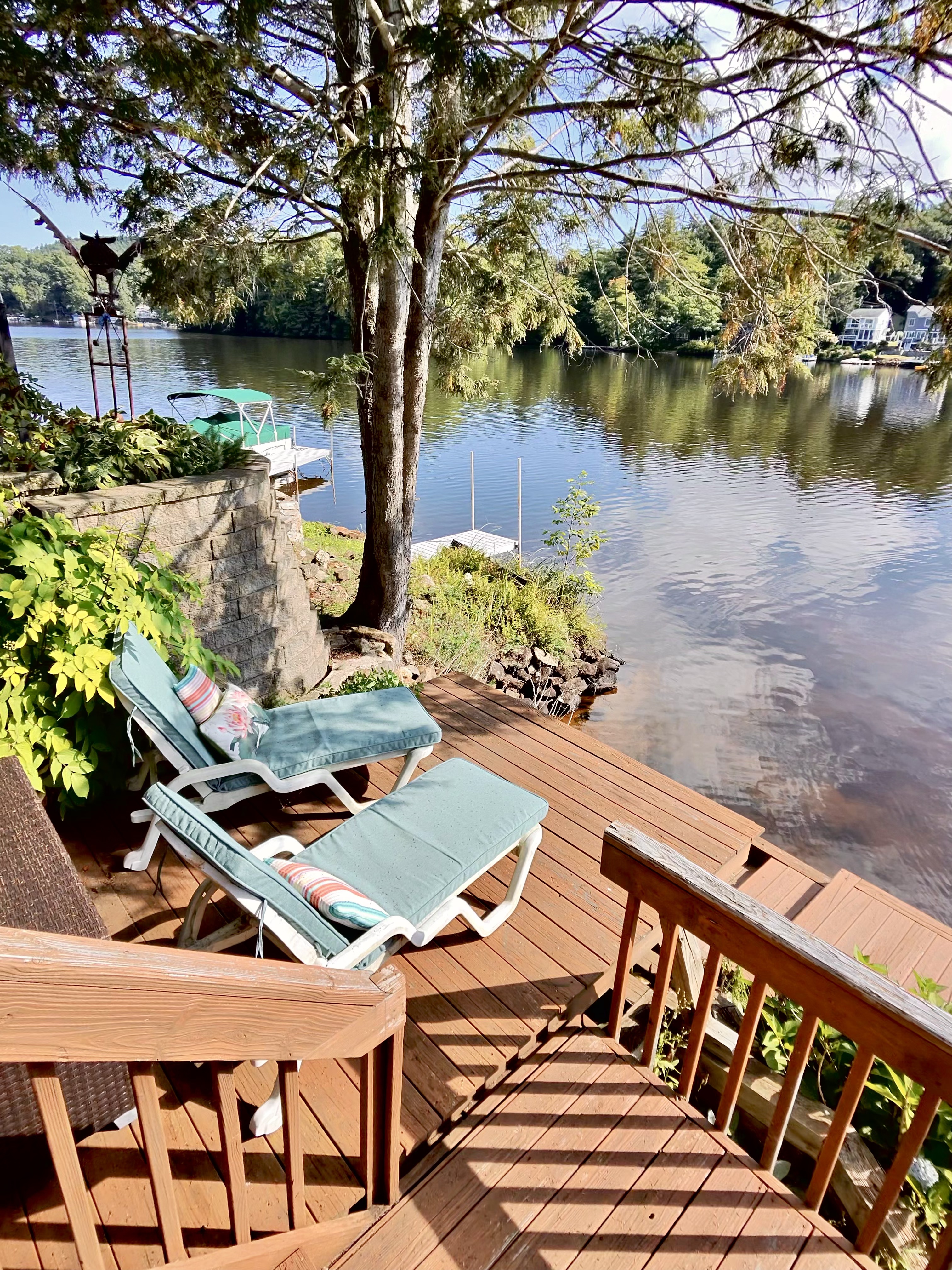 Lounge chairs on deck with lake view