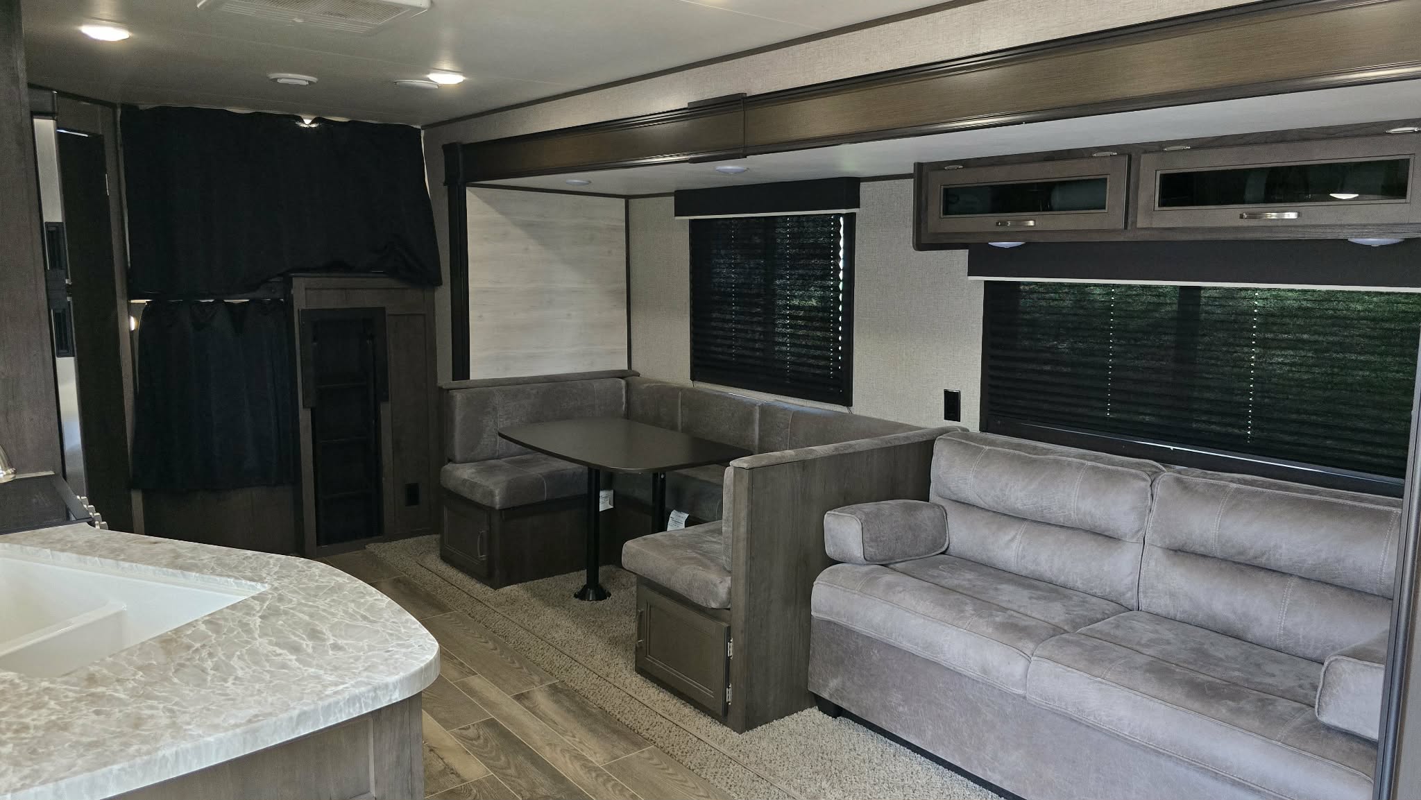 2021 Jayco Bunk - Living area with dinette and sofa