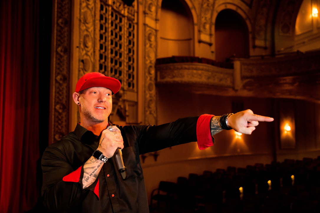 Travis Crutcher on stage at the Historic Hoyt Sherman Theatre