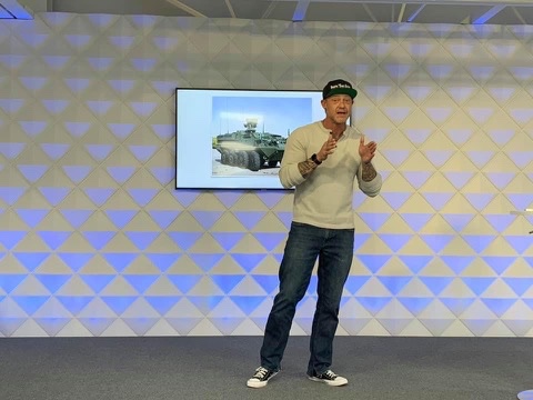 Travis Crutcher speaking at a corporate event