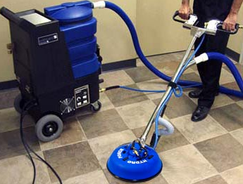Professional tile and grout cleaning using rotary extraction machine