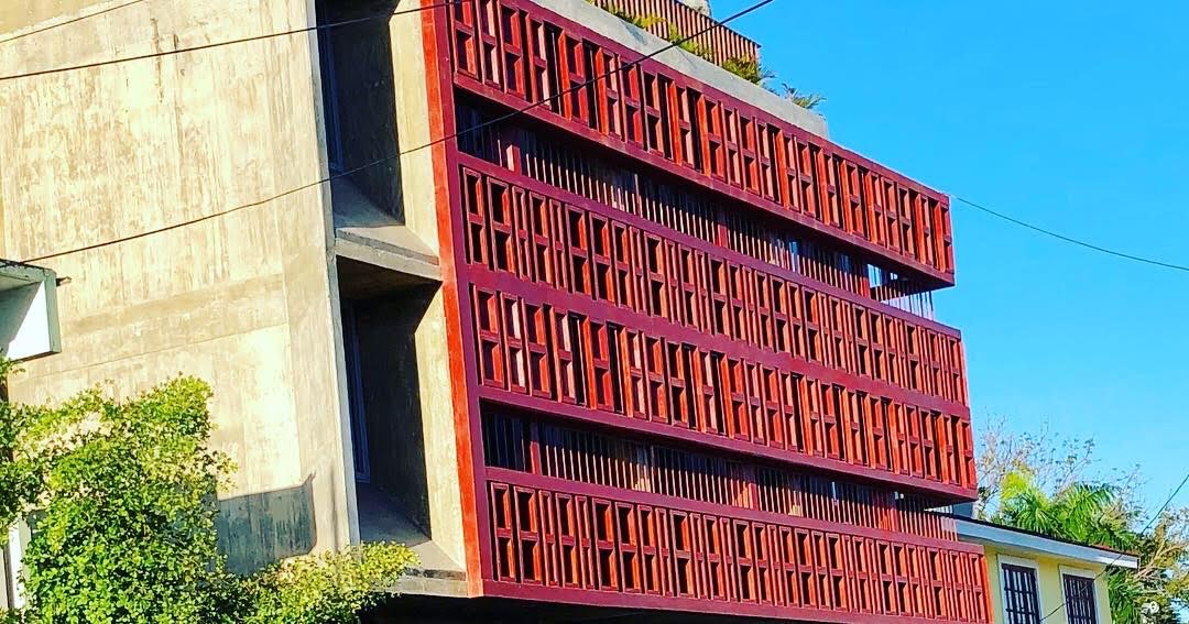 Dream Inn San Juan — striking red geometric lattice facade