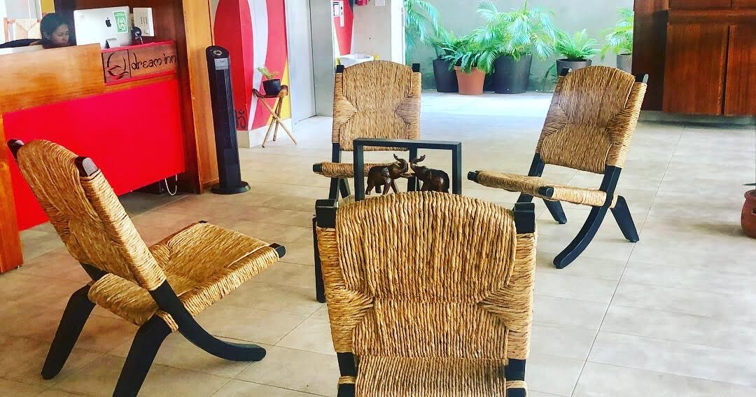 Dream Inn San Juan — lobby with woven wicker chairs and tropical plants