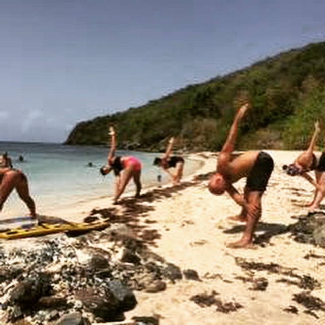 Beach yoga and fitness session on a Caribbean beach in Puerto Rico