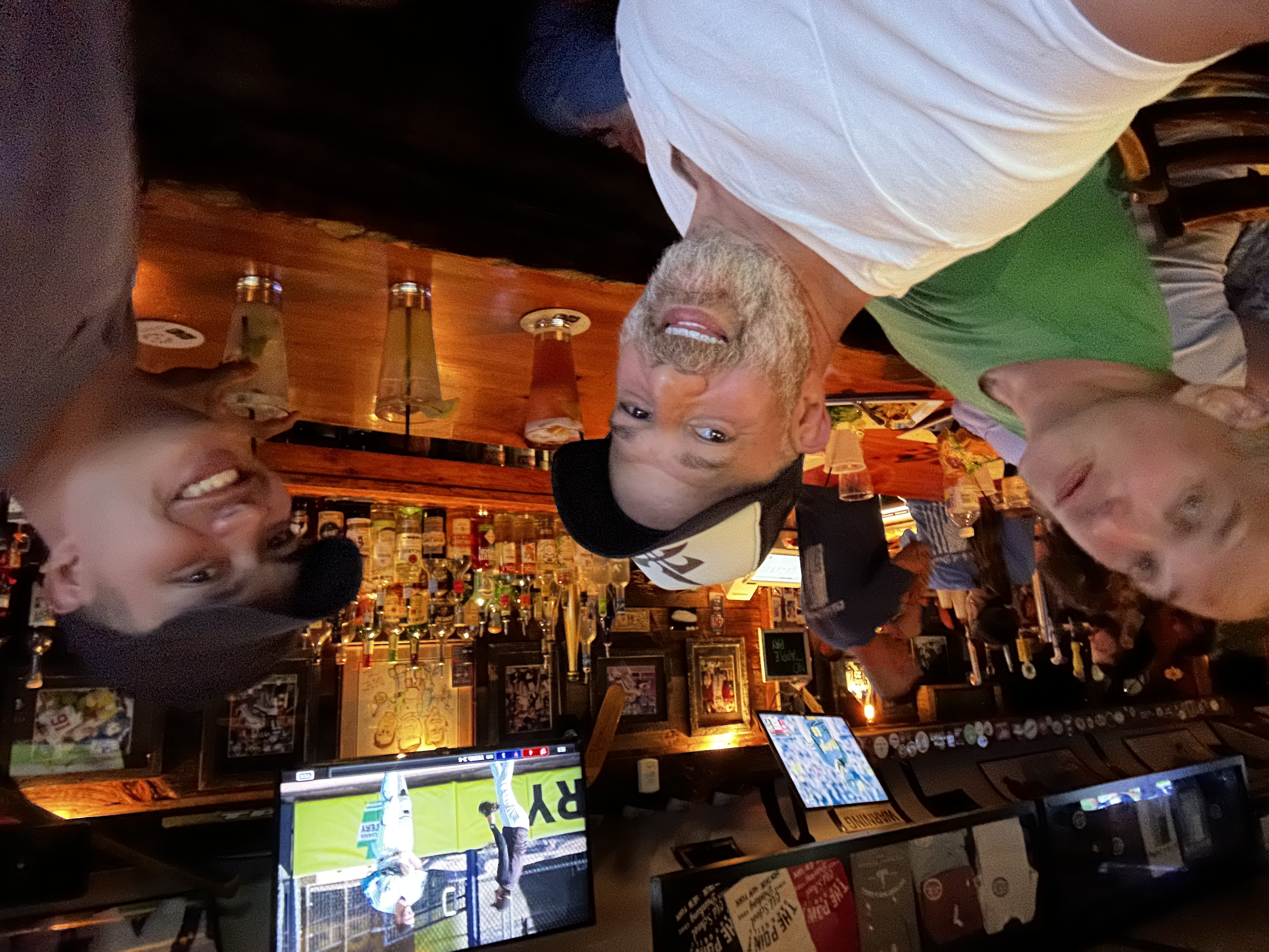 Xavier and friends at the bar at 668 The Gig Shack — bar selfie with cocktails, Montauk Saturday night bar crawl