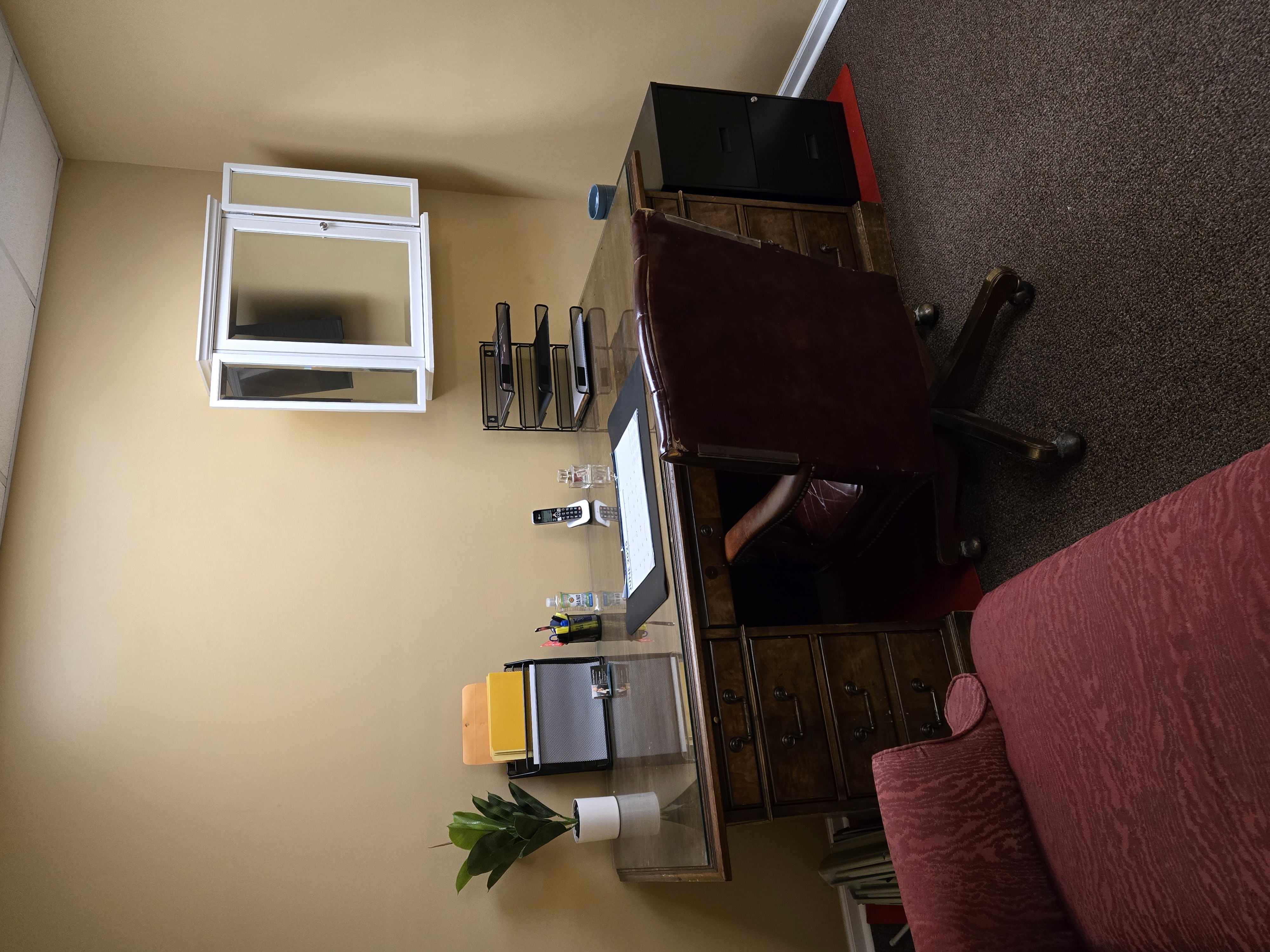 Private Office in Suite B Office 2 with executive desk, leather chair, file cabinet, and wall-mounted cabinet
