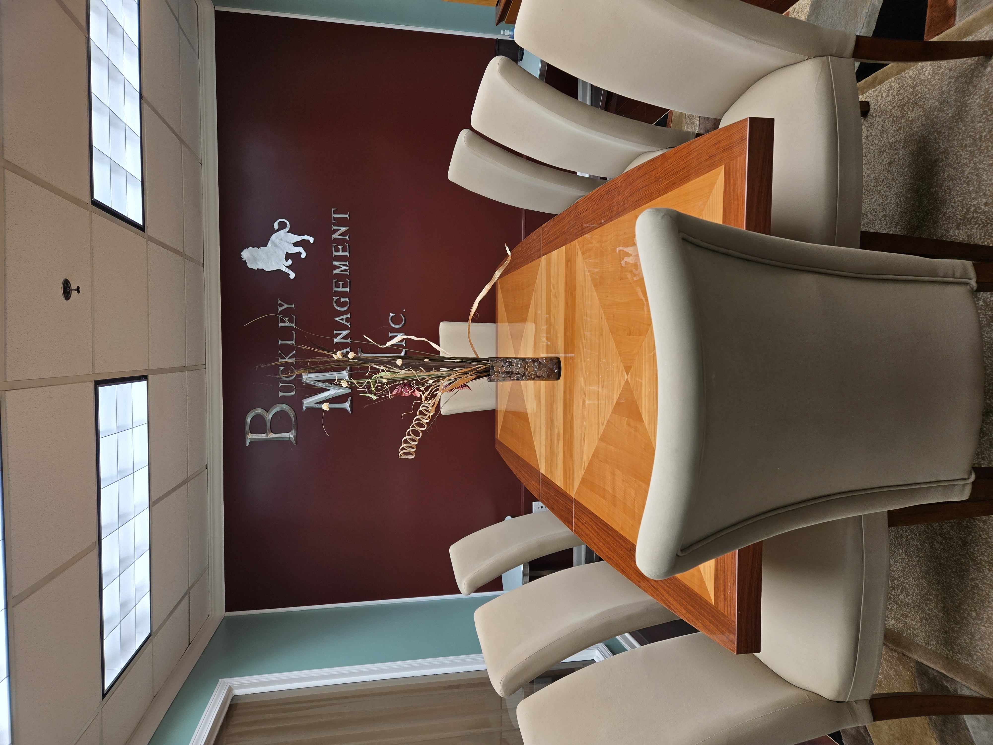Suite C conference room at The Majestic Office Center with conference table and seating