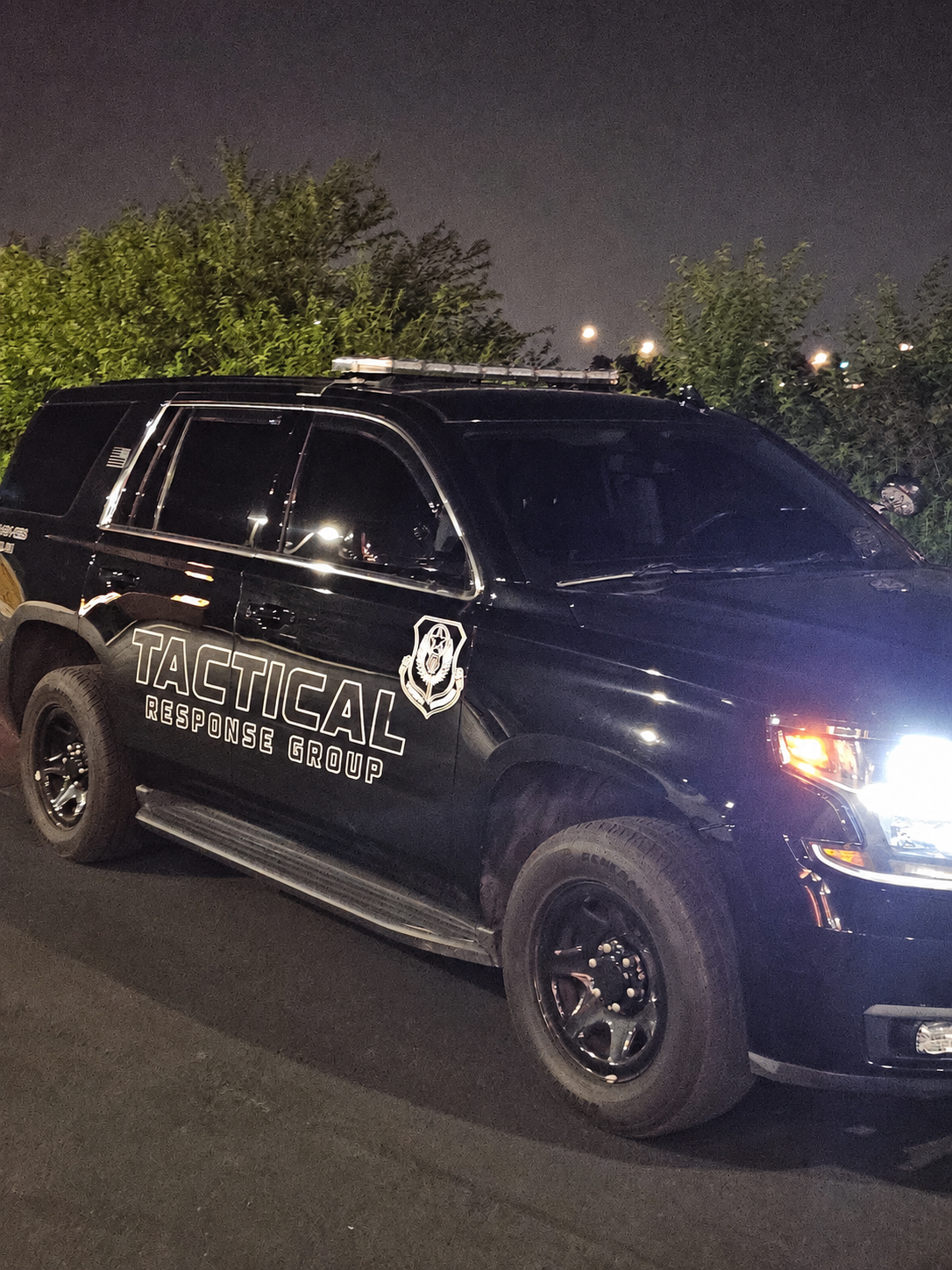 Tactical Response Group marked patrol vehicle on duty at night