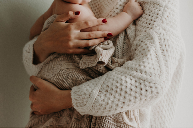 Mom holding newborn baby