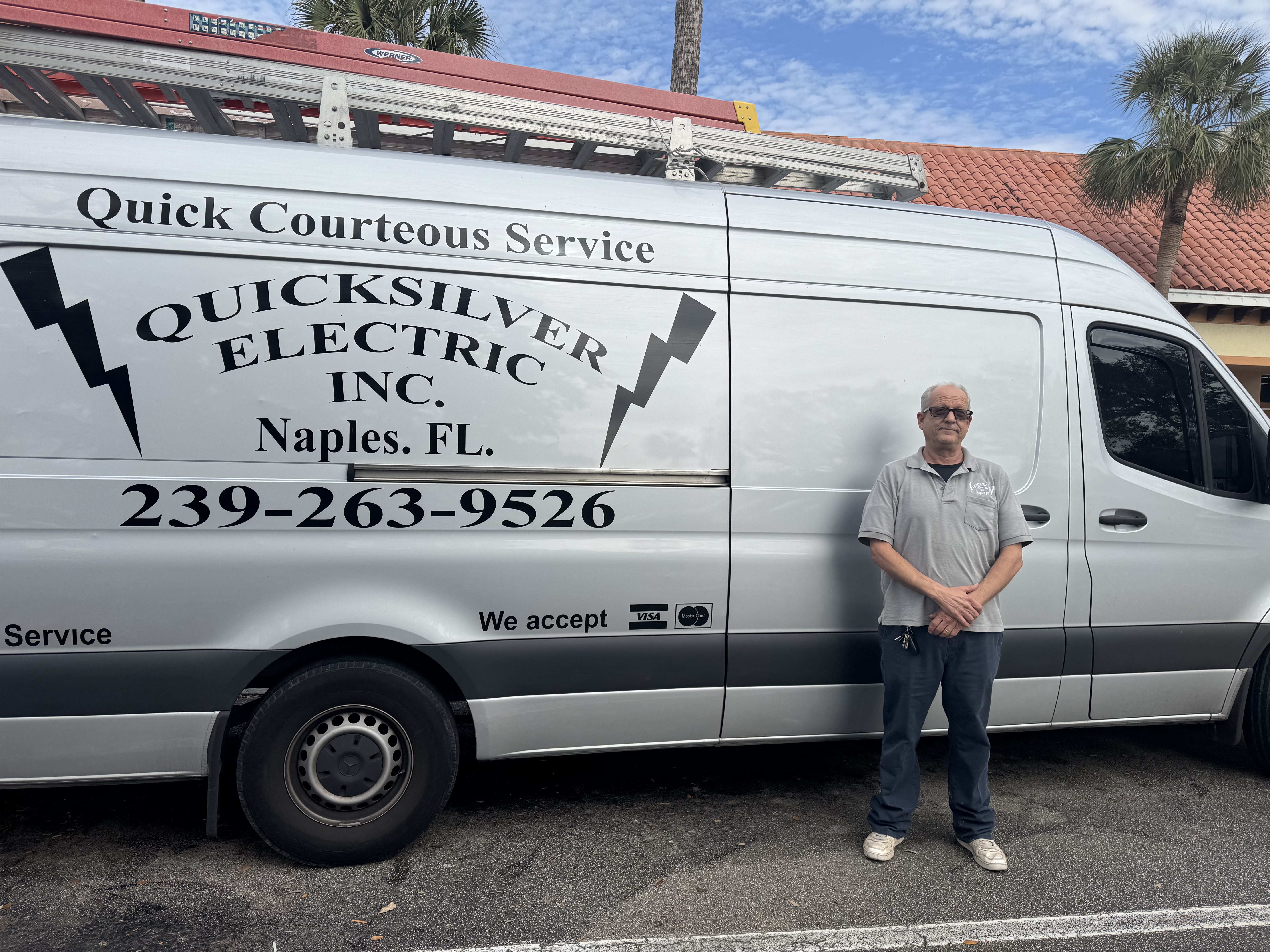 Mark Mentillo standing next to the Quicksilver Electric service van in Naples, FL