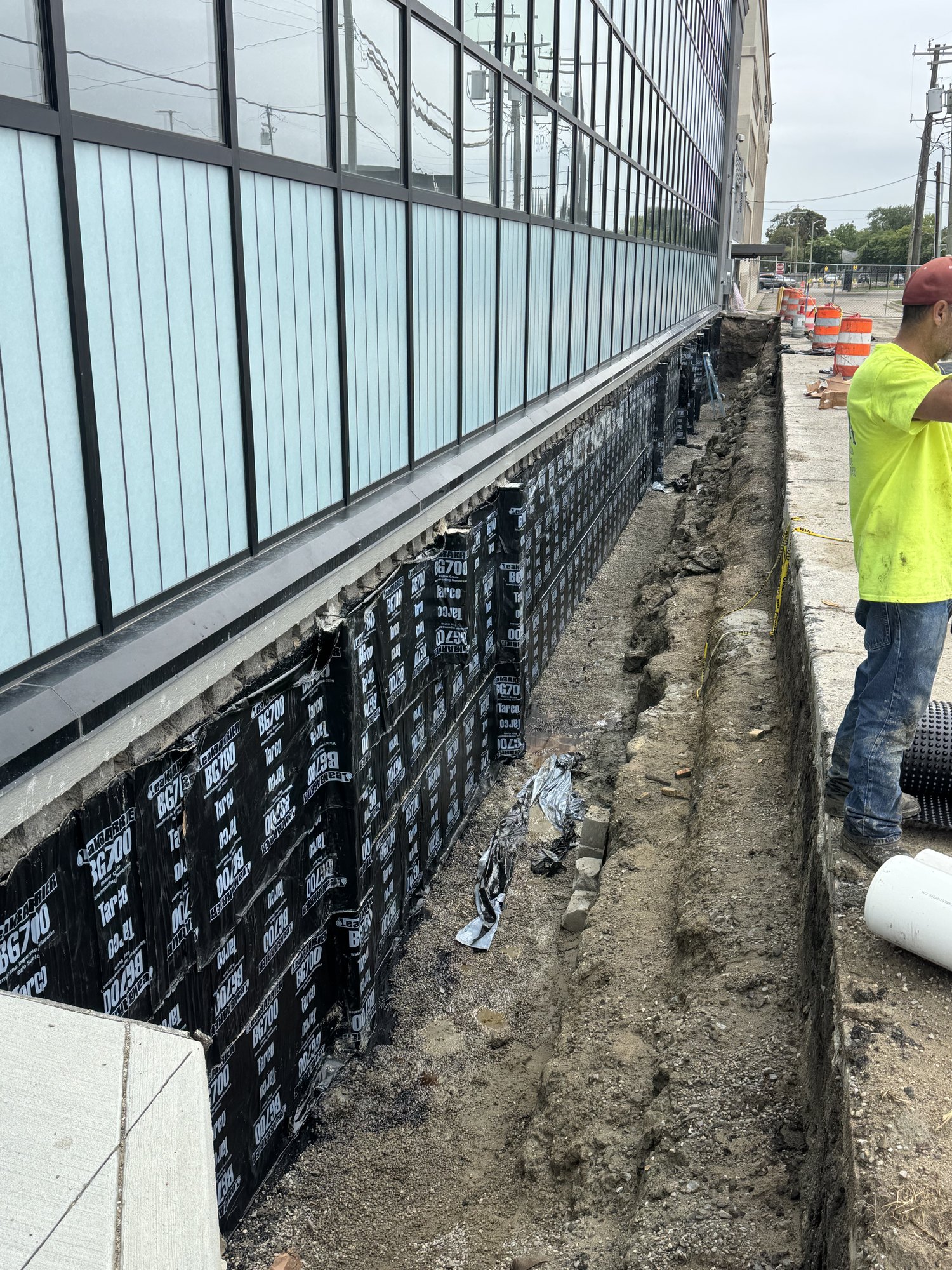 Self-Adhering Sheet Membrane Over Liquid Coating
