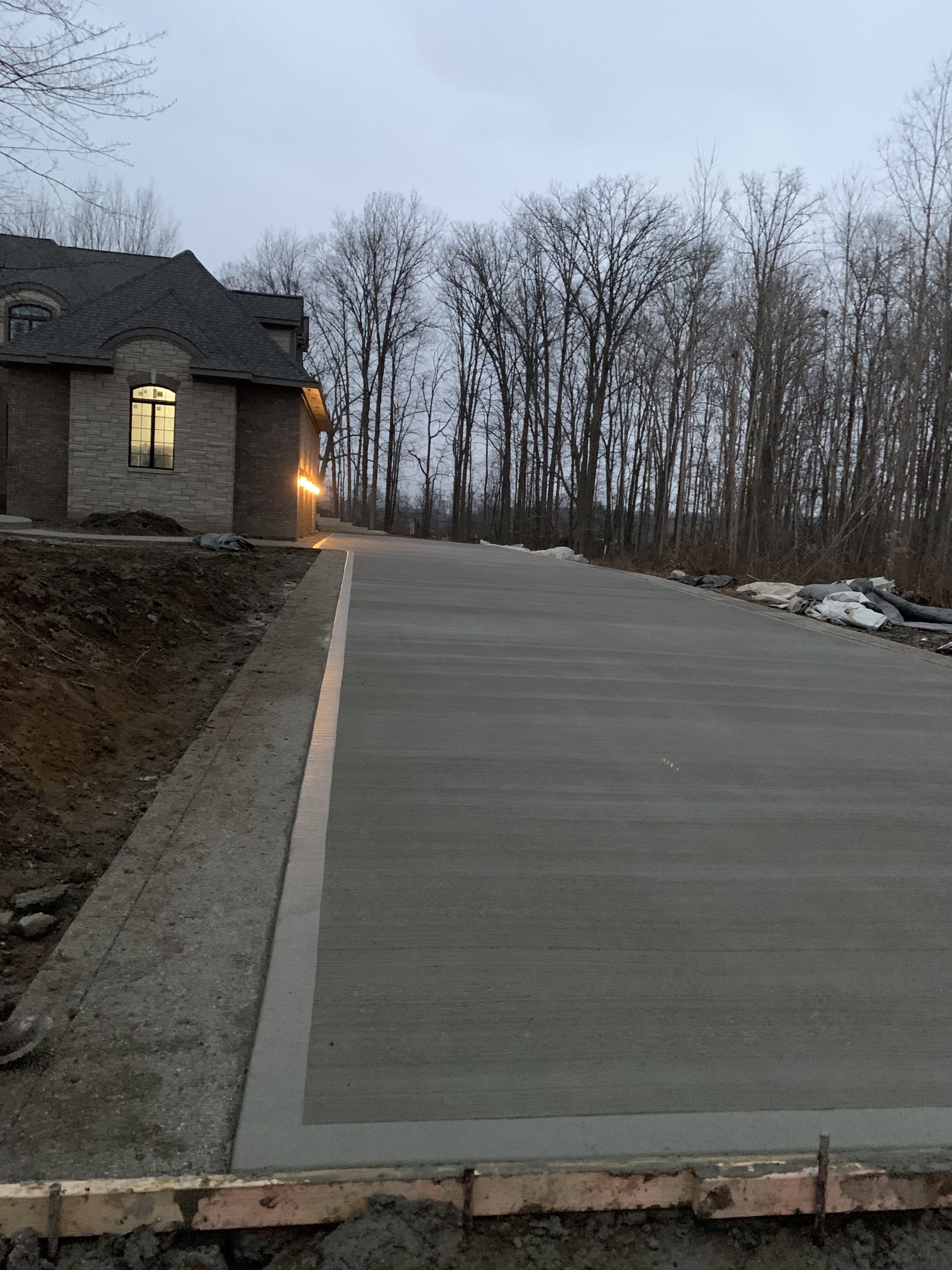 Fresh Concrete Driveway — Luxury Home