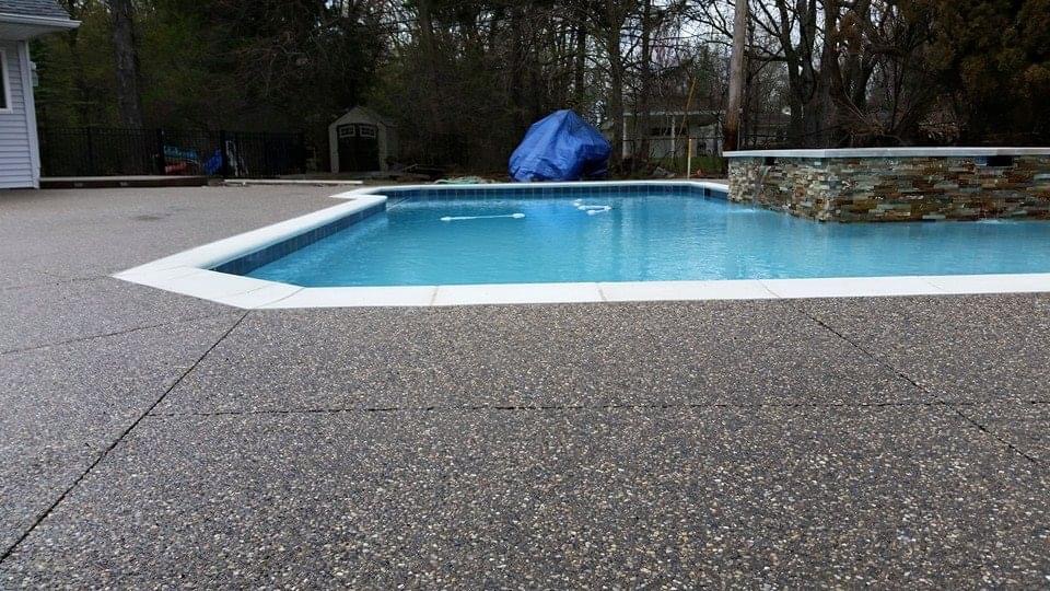 Completed Pool — Aggregate Deck & Stone Wall