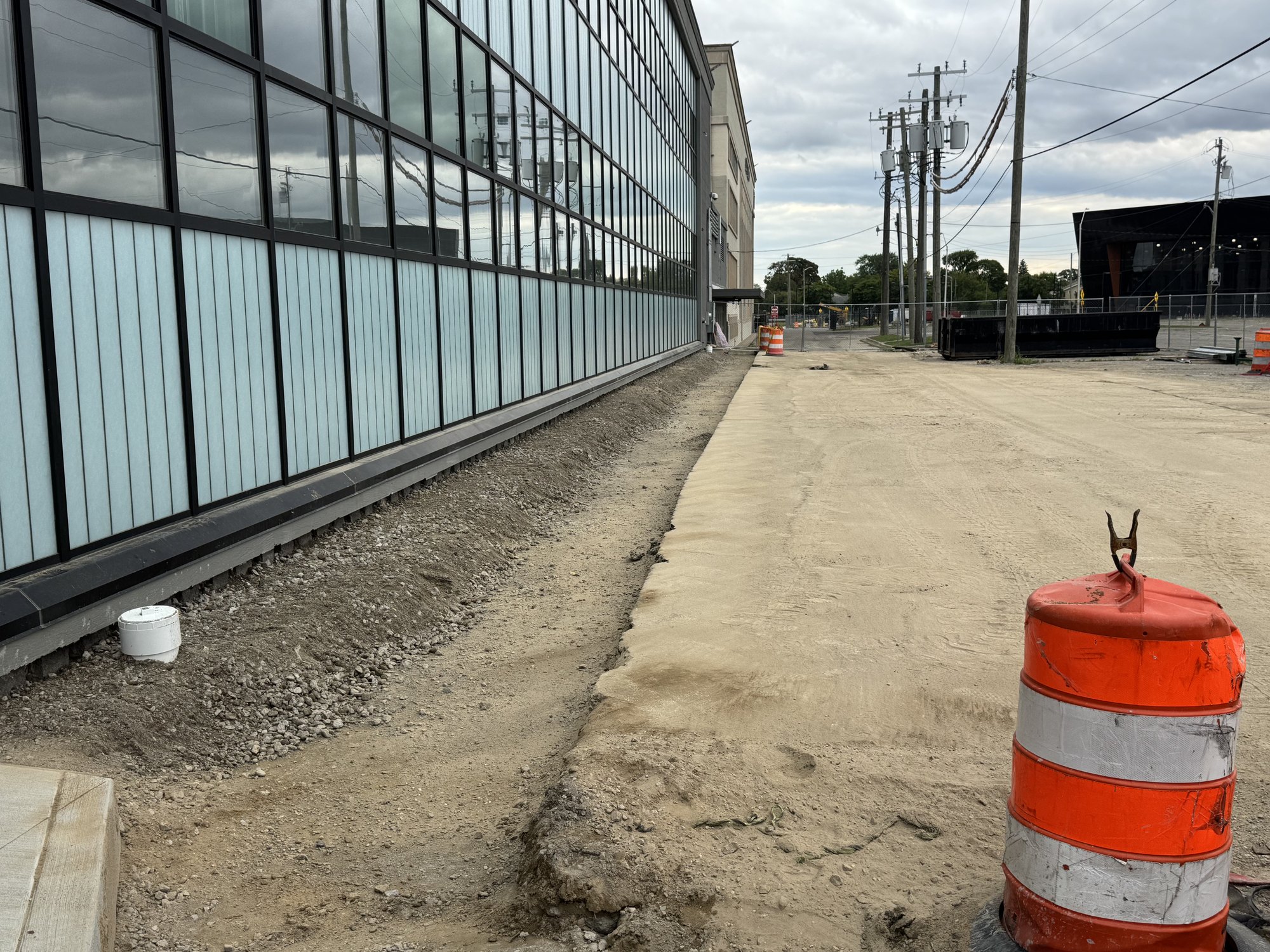 Wall Complete — Backfilled, Compacted & Graded