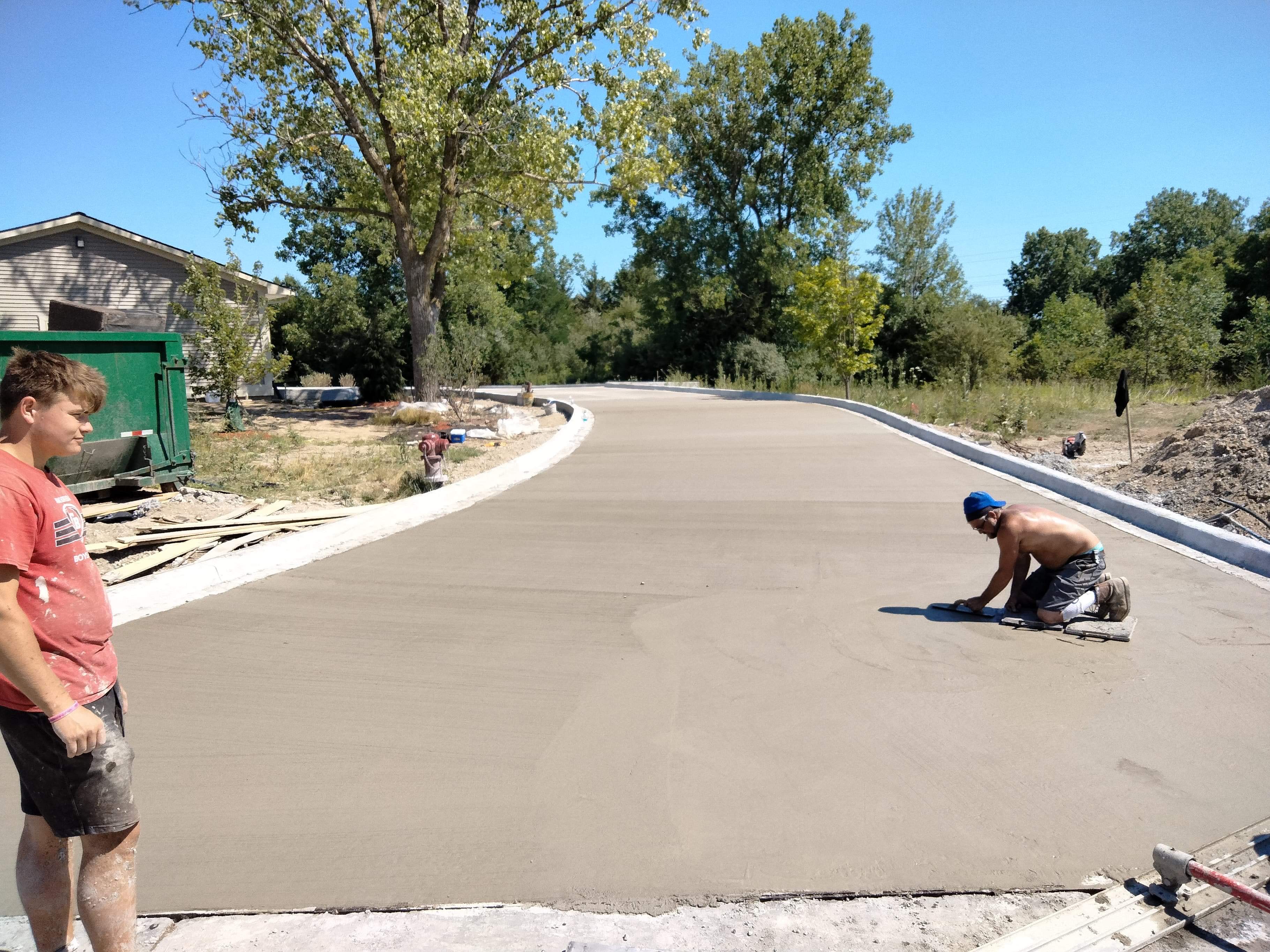 Large Concrete Driveway Pour — Hand Finishing