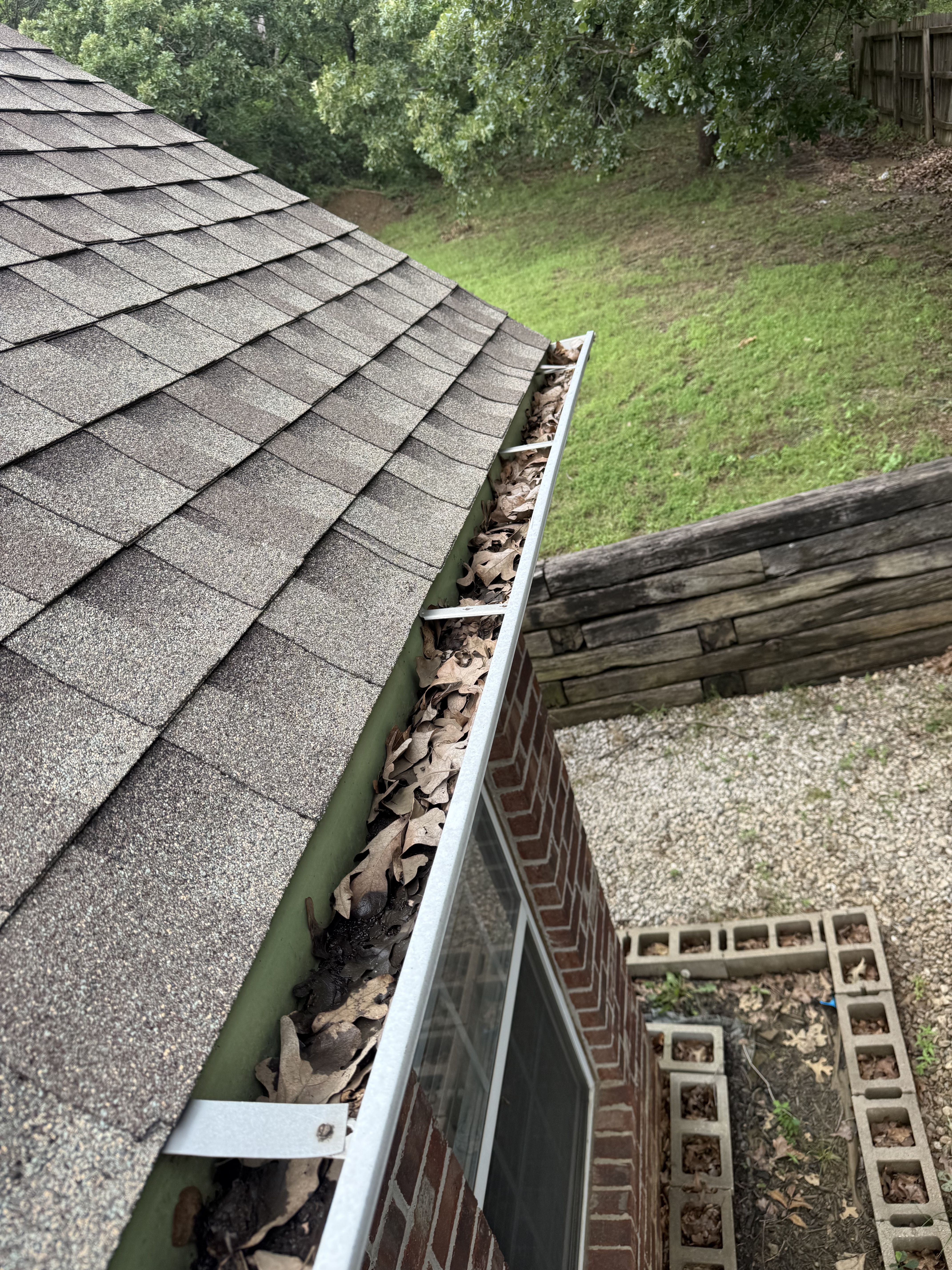 Clogged gutter before cleaning Tulsa