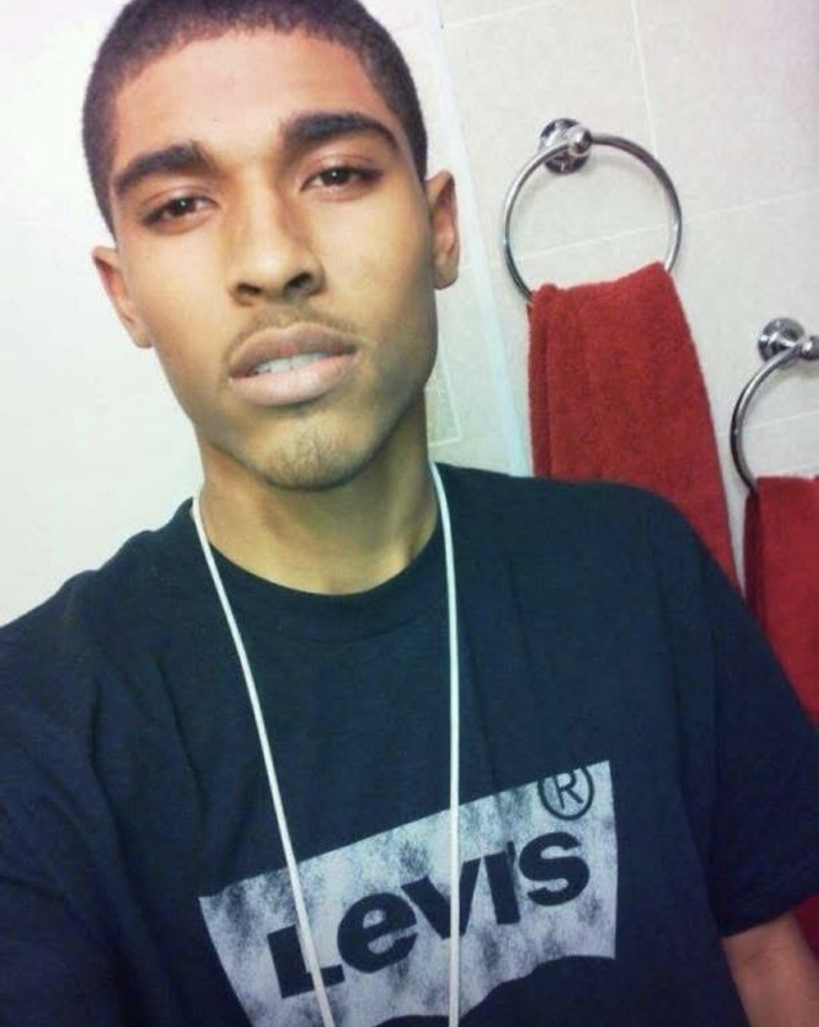 Javon Quezaire Whiteside-Lopez β a confident young man in a Levi's shirt, looking directly at the camera