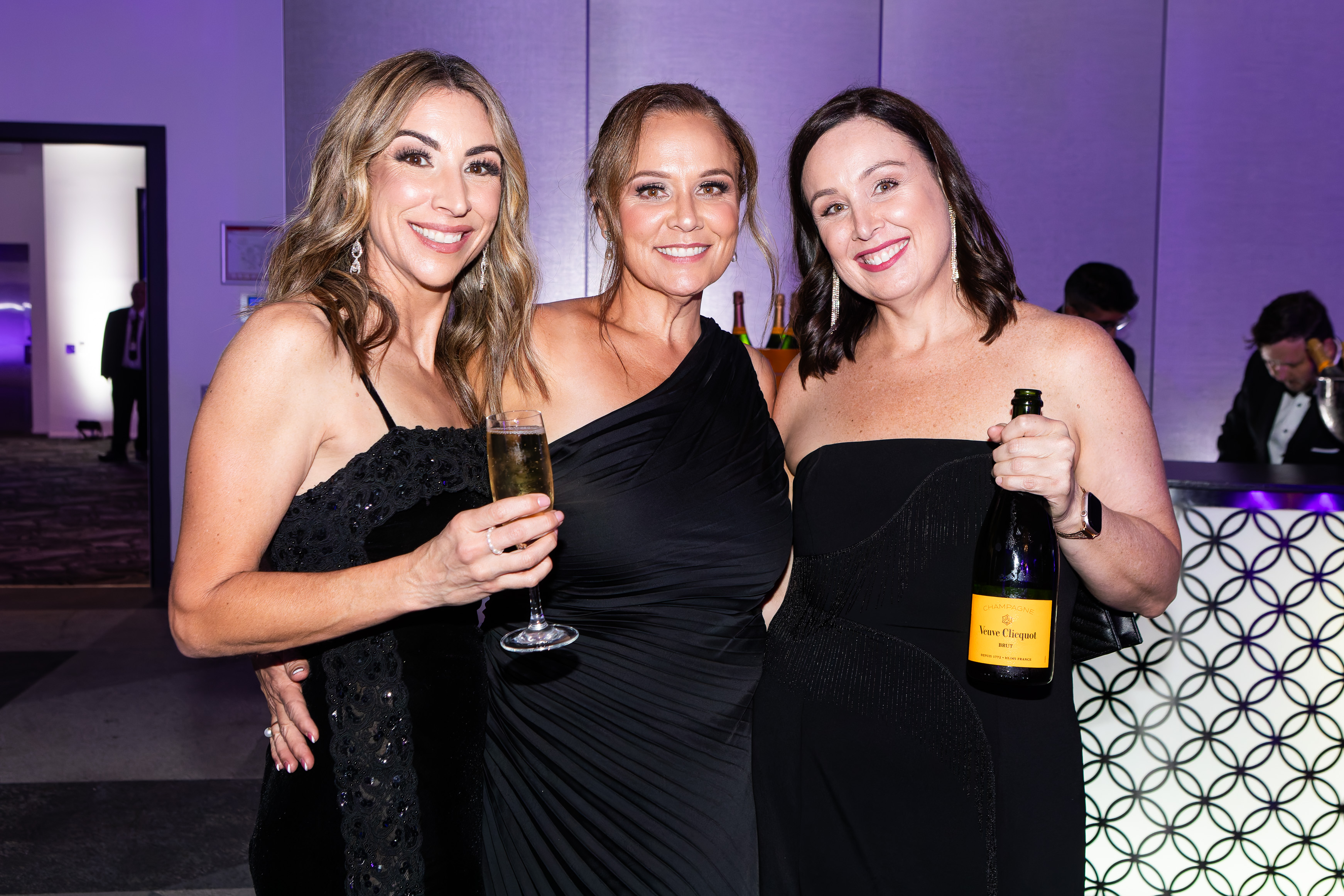 Friends with champagne at the Grey Matter Gala 2025