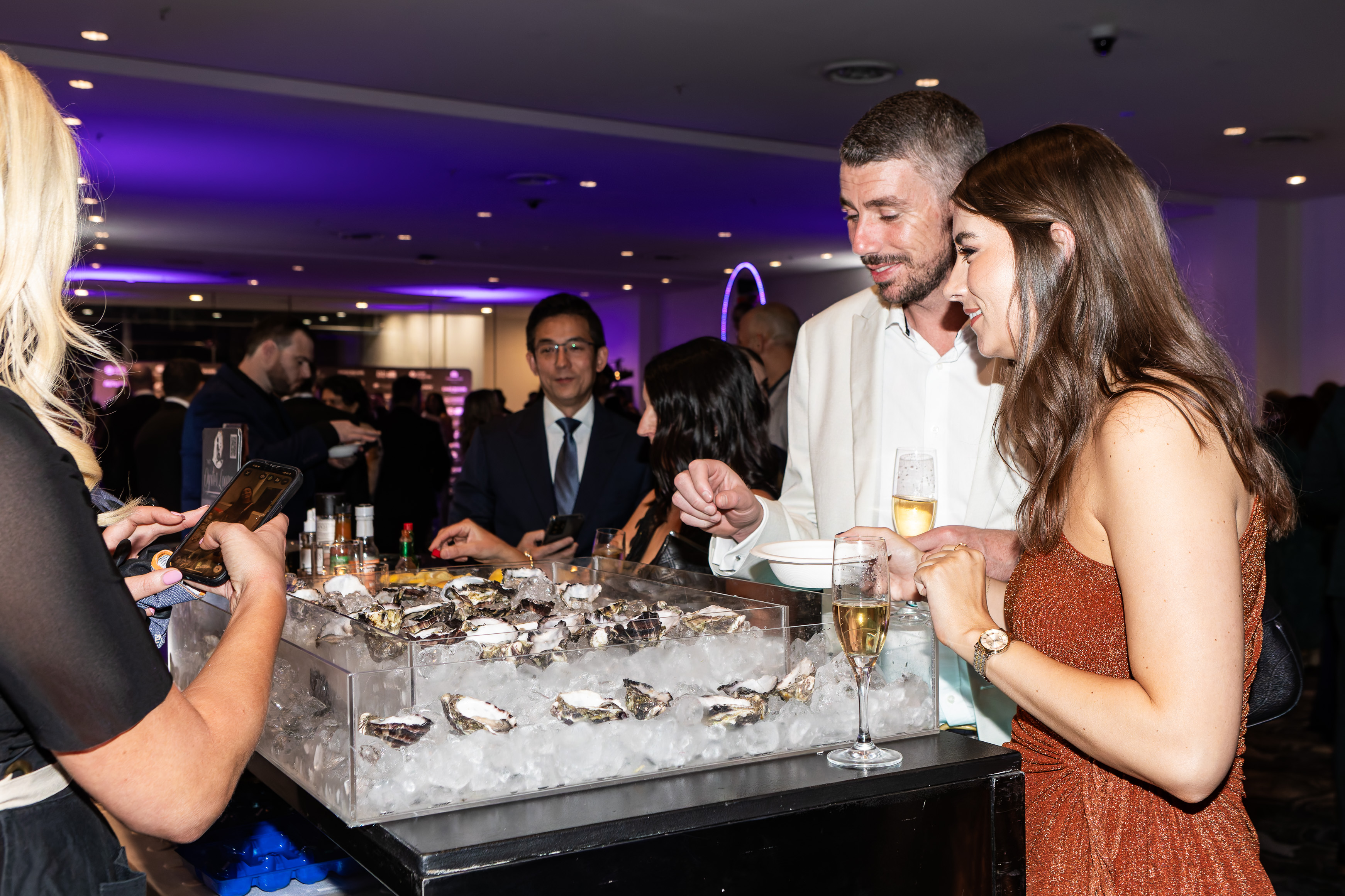 Guests enjoying the oyster bar at the Grey Matter Gala 2025