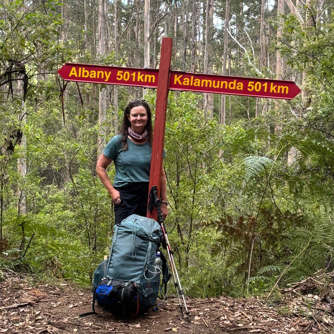 Lana Hinton at the Bibbulmun Track halfway signpost — Albany 501km, Kalamunda 501km