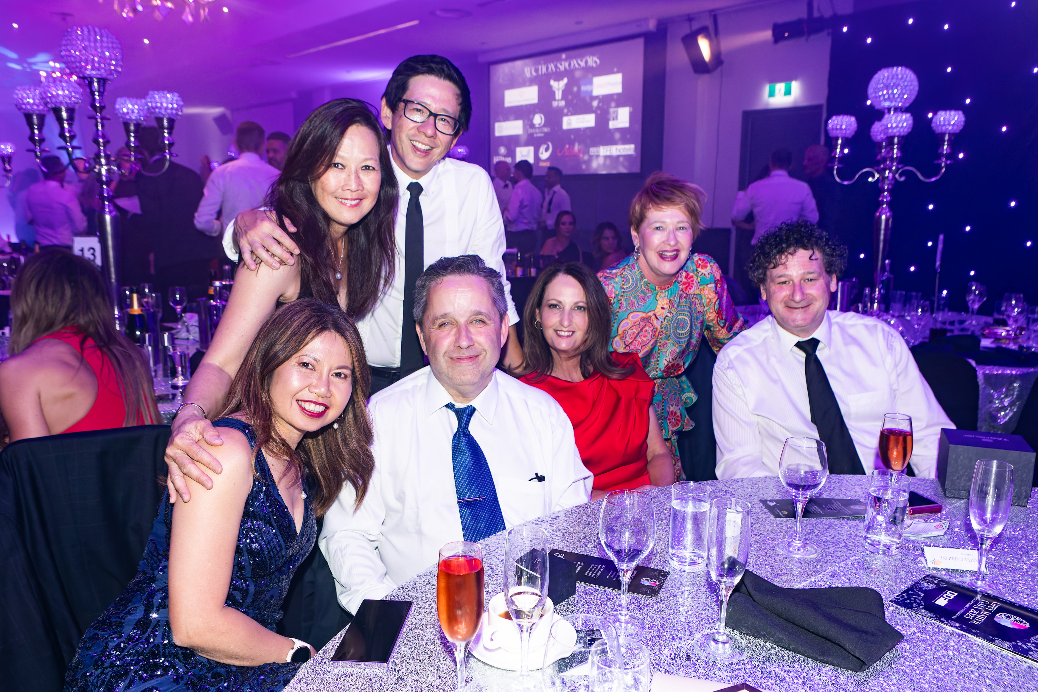 Group of friends at their table at the Grey Matter Gala 2025