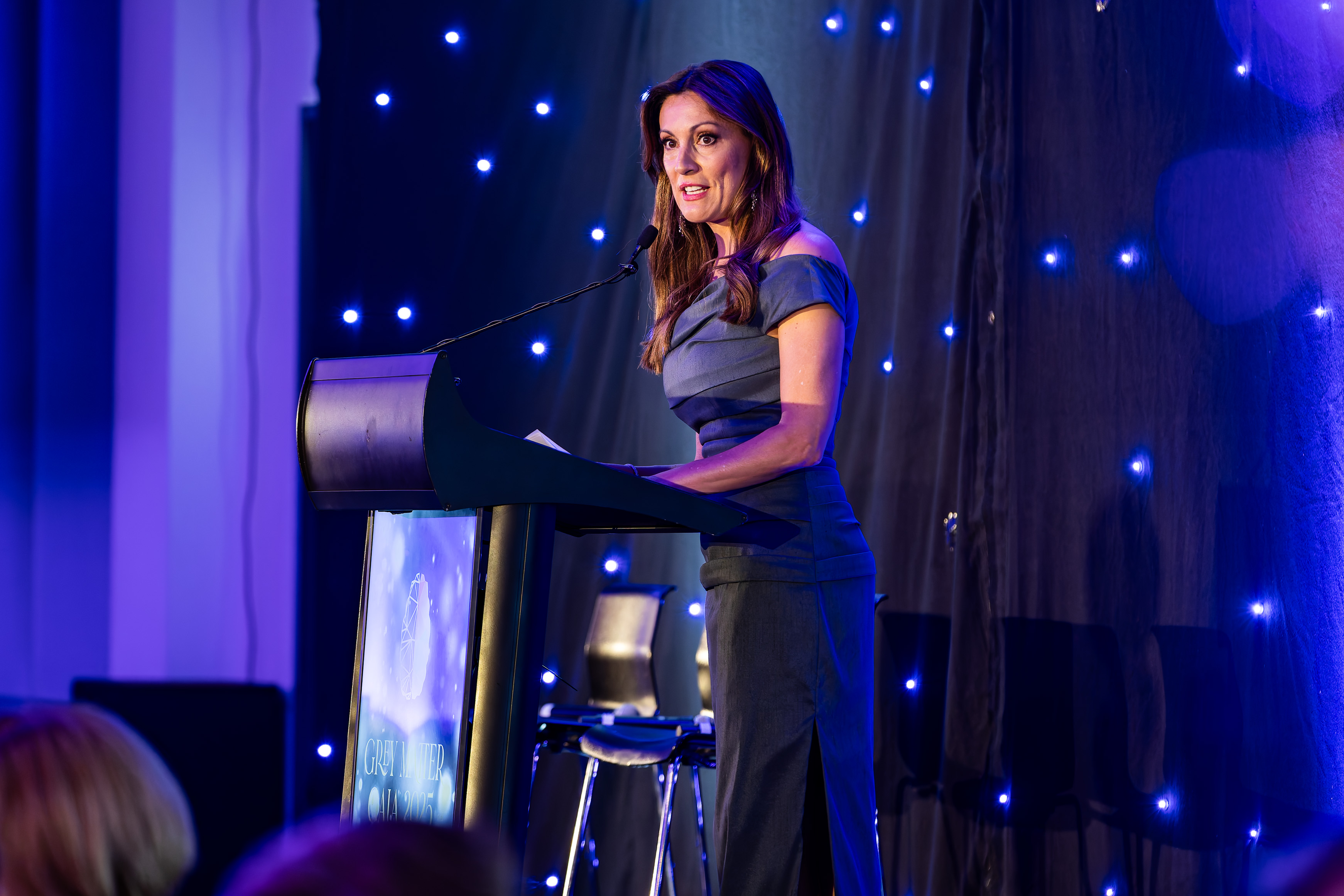 Speaker presenting at the Grey Matter Gala 2025