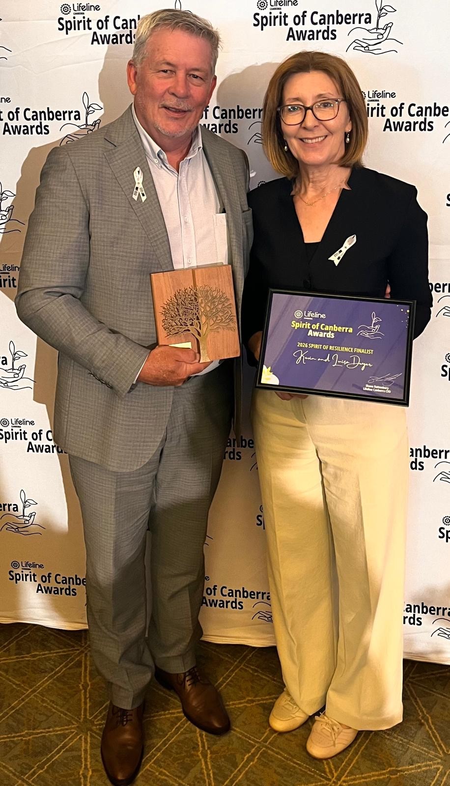 Kevin and Luisa Dwyer, DDF Directors, holding the Spirit of Impact Award plaque and certificate at the 2026 Lifeline Spirit of Canberra Awards
