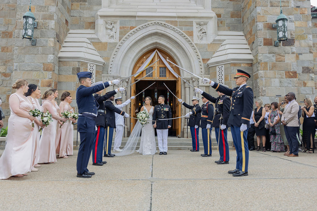 Military sword arch at wedding