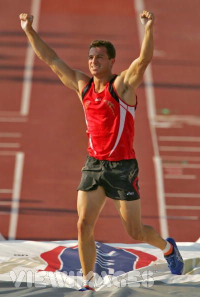 Russ Buller celebrating a championship pole vault victory